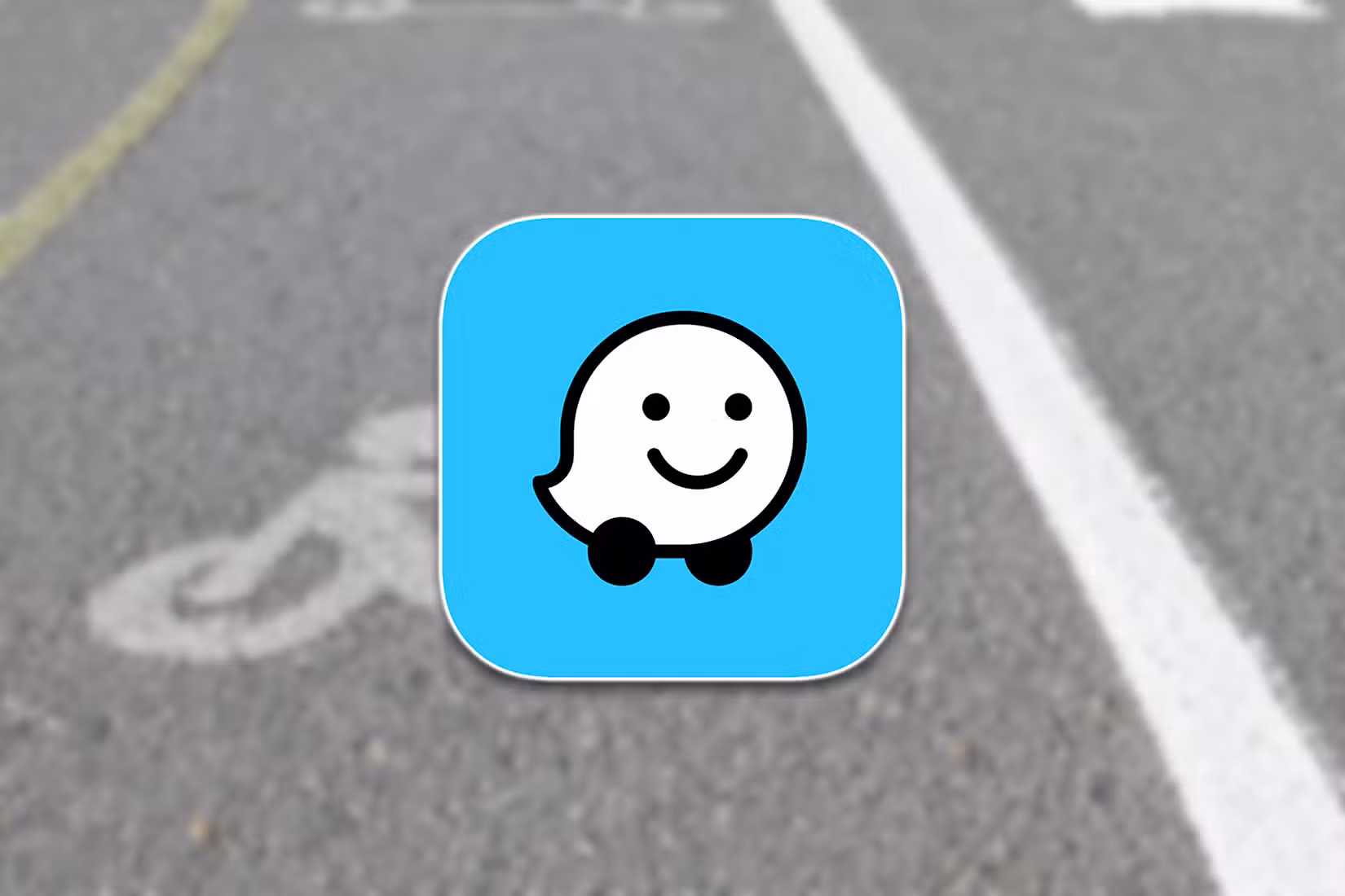 The Waze logo over a photo of a road.