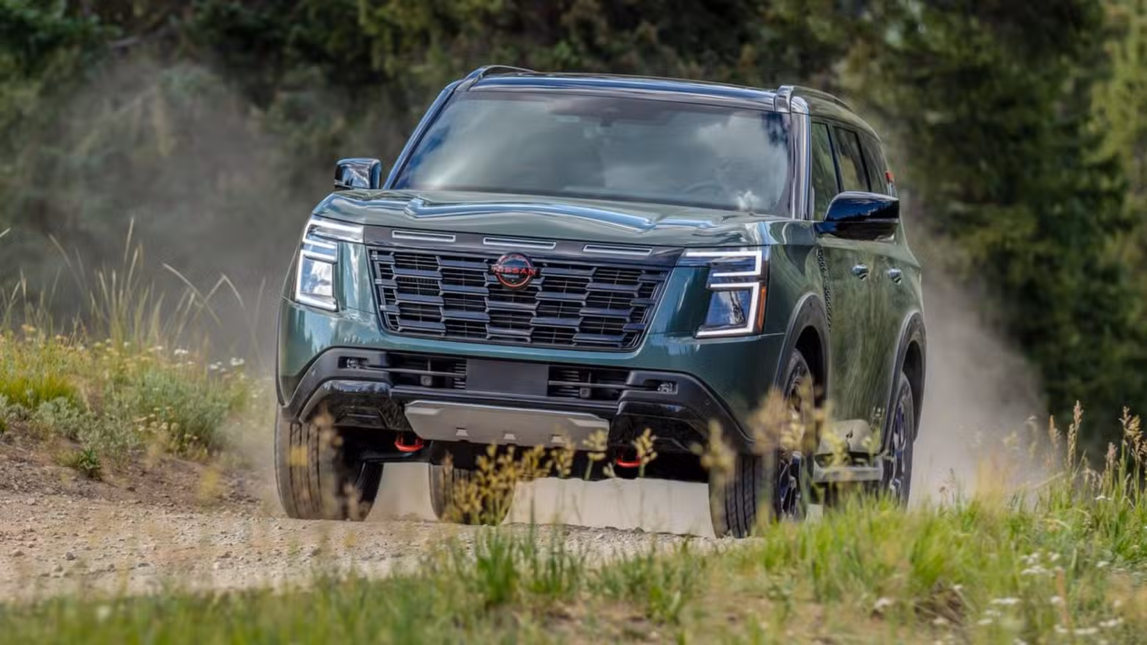 Dynamic front 3/4 shot of a green 2025 Nissan Armada.
