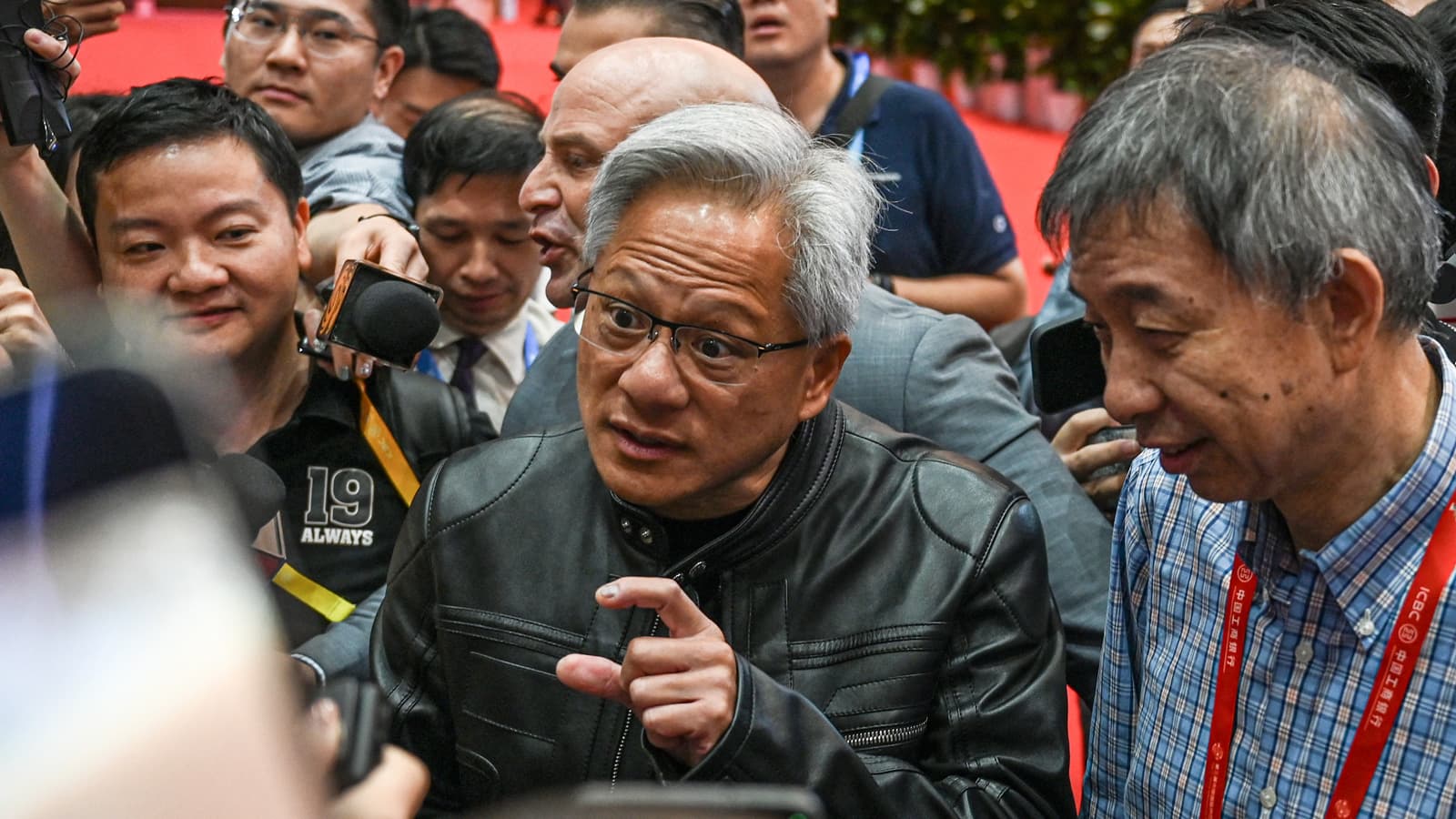 Jensen Huang explaining the size of something to the press.