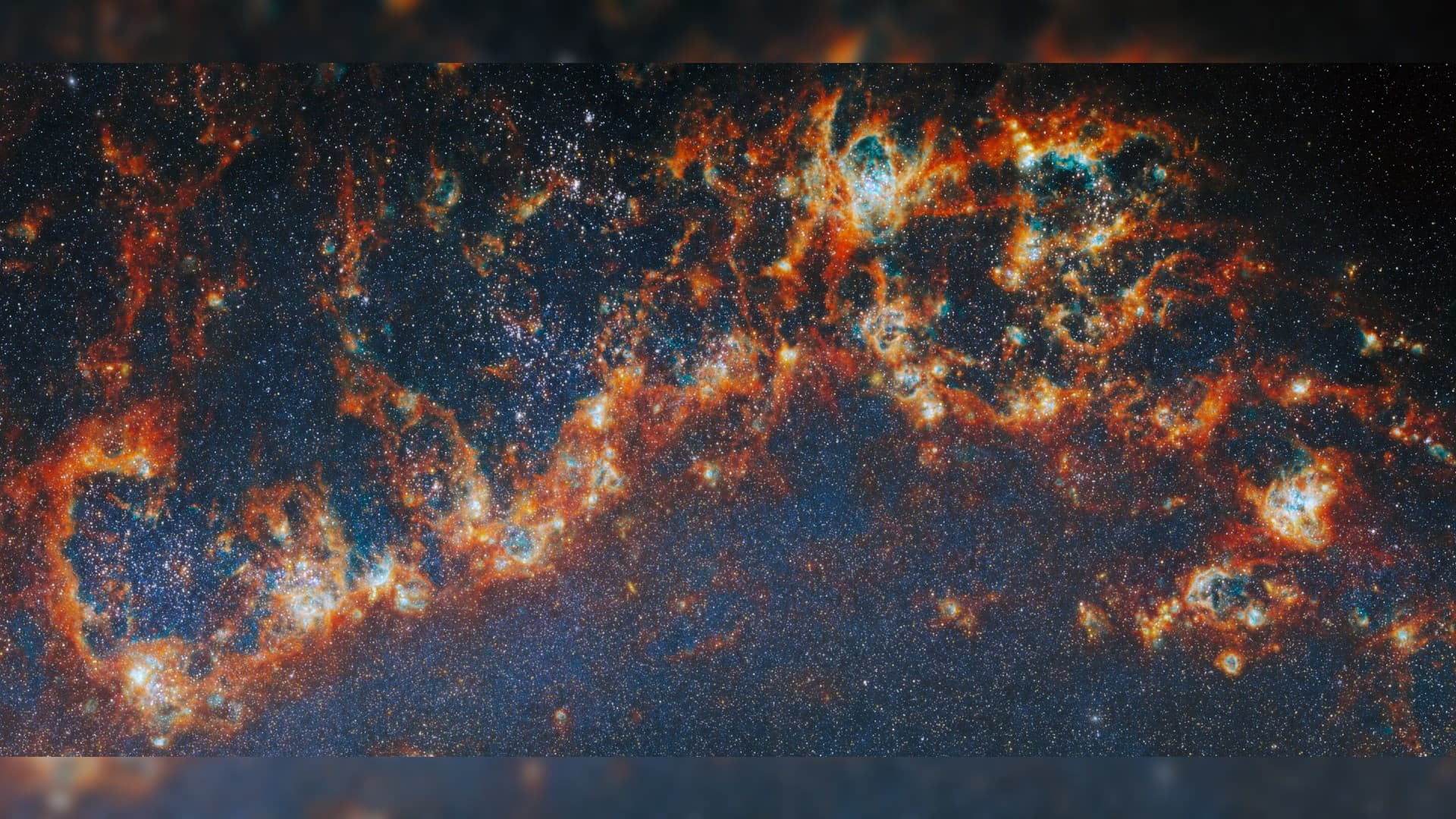 a curl of red-and-white gas on a black starry background