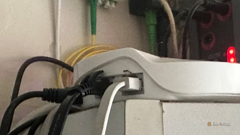 Some cables plugged into a router with a fiber outlet visible in the back.