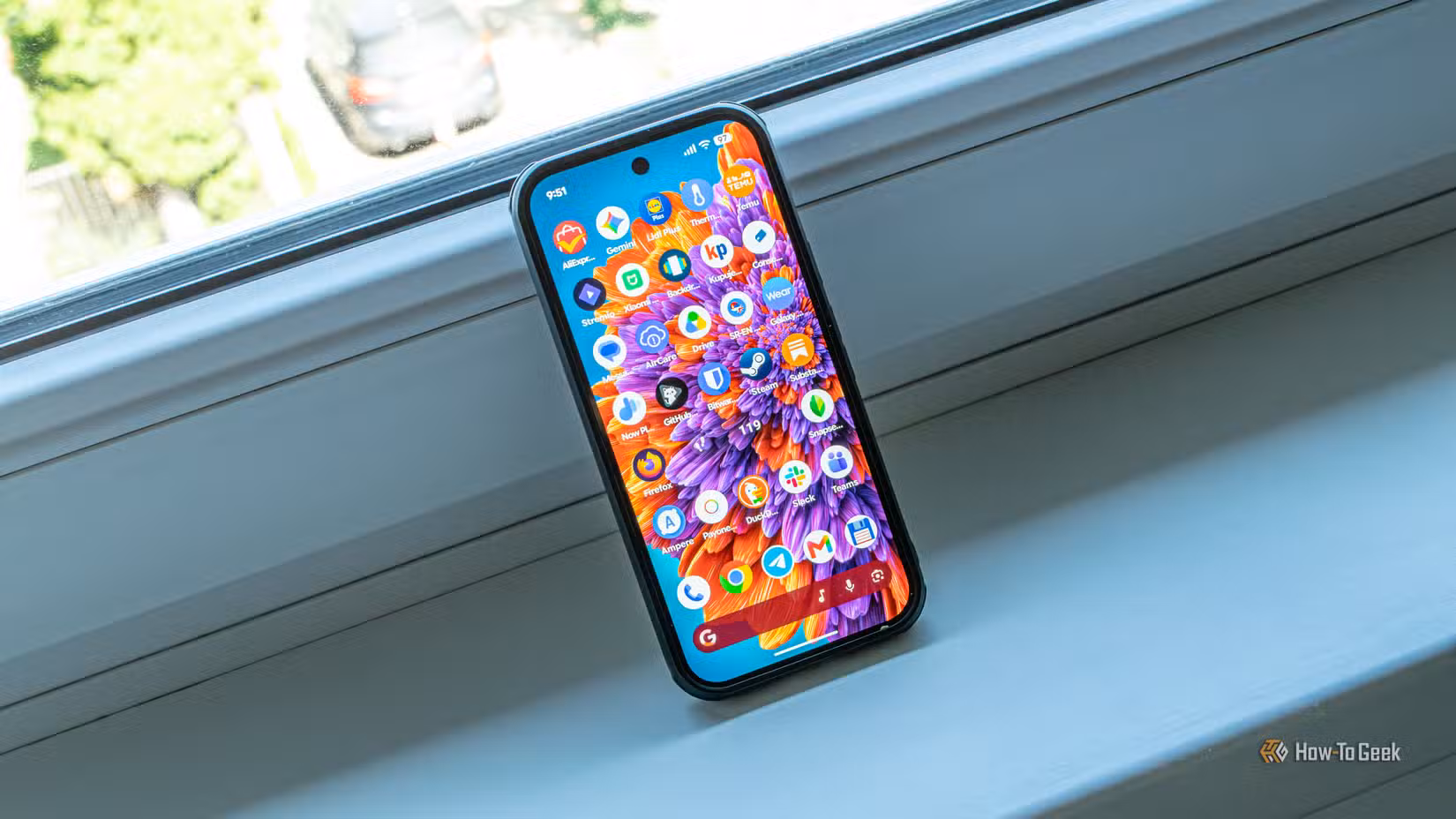 A Pixel 10 Pro resting on a windowsill.