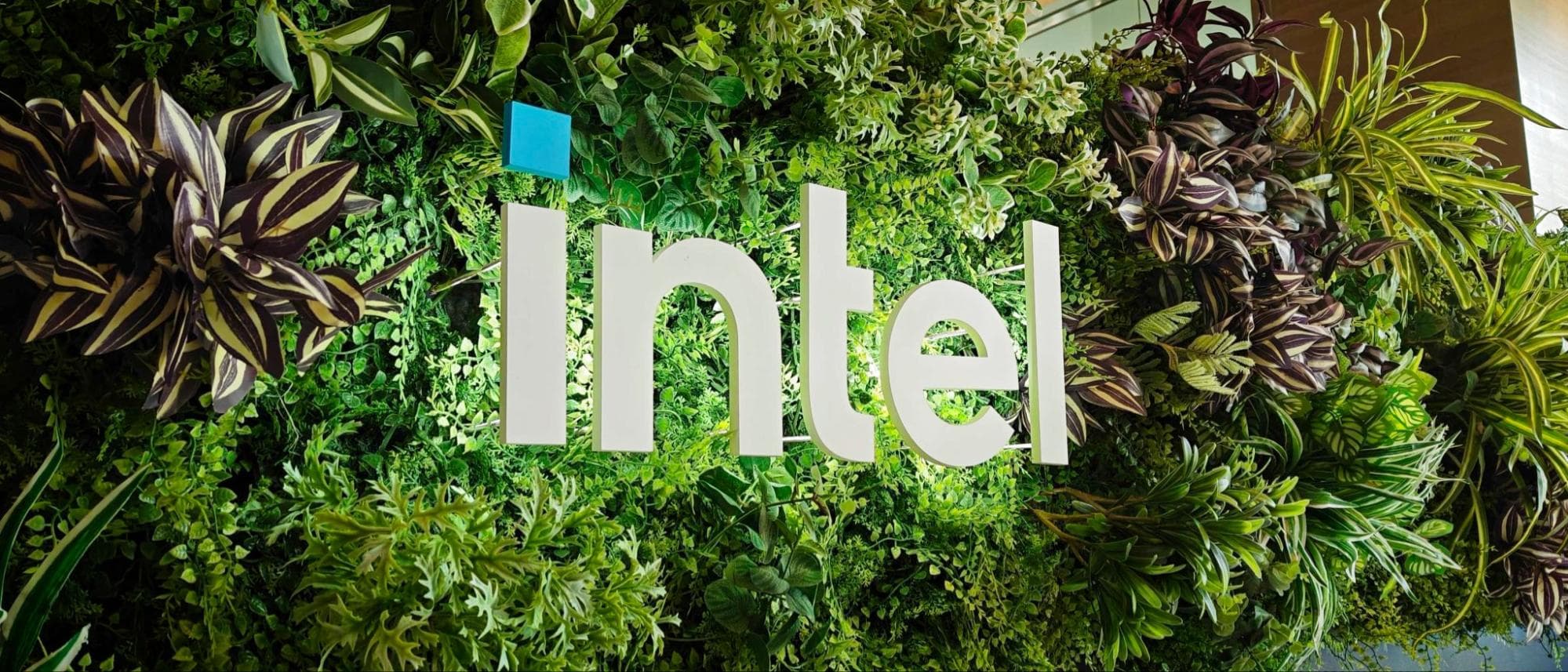 Intel Logo on a wall of plants with a slight underglow