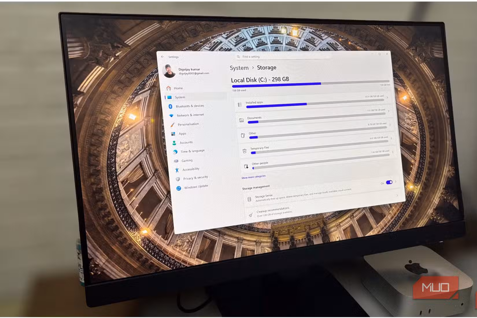 Windows storage settings showing disk usage and storage sense on an external monitor.