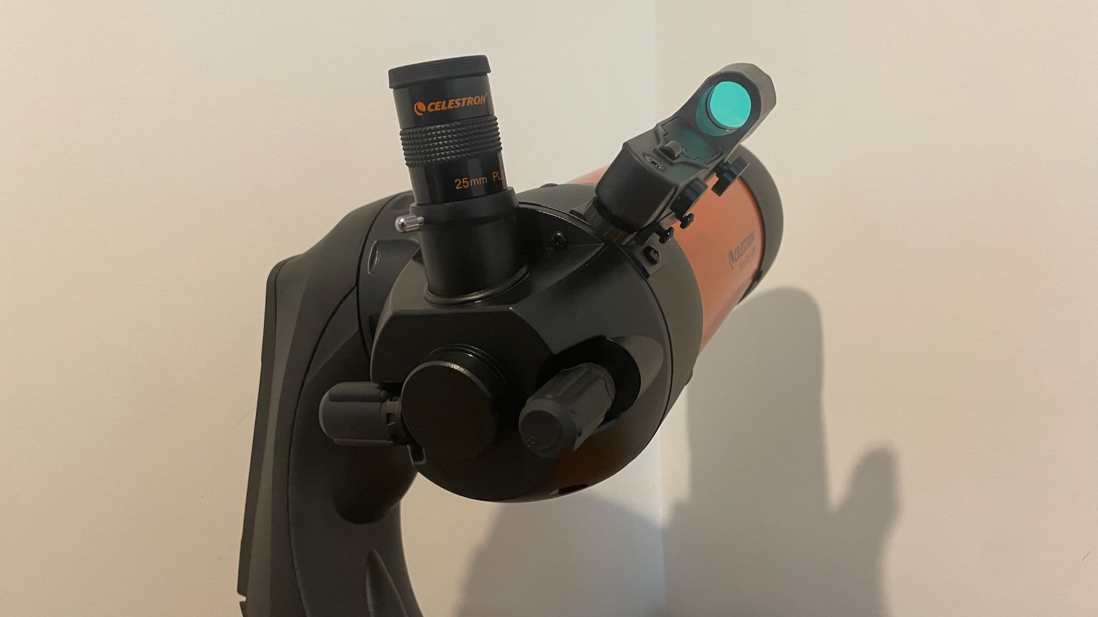 A close up of the eyepiece on a wooden table
