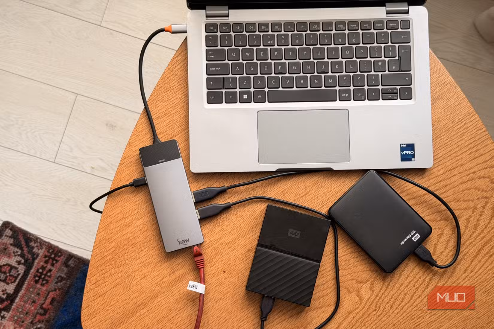 Dell Latitude connected to USB-C Thunderbolt hub with two external hard drives
