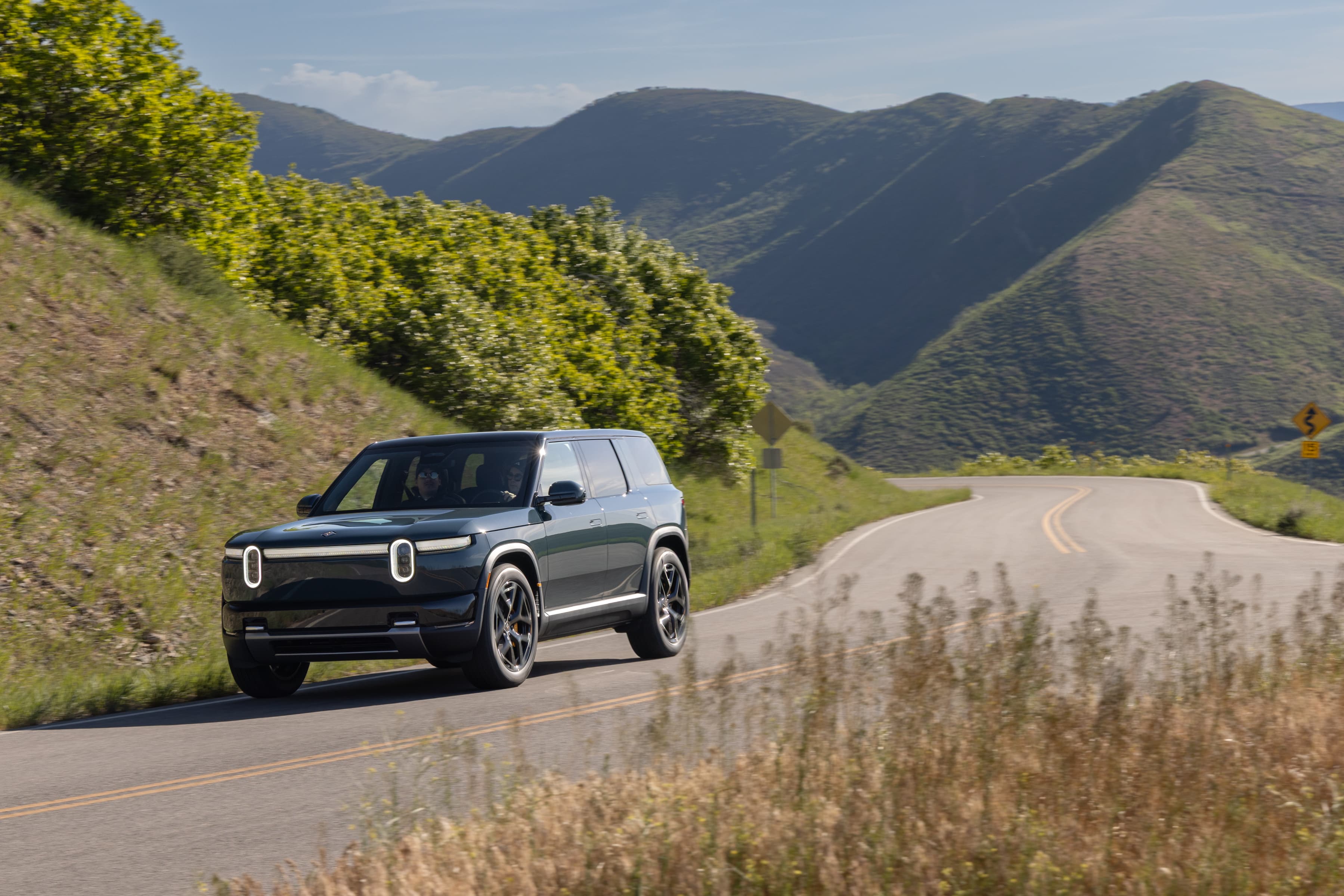 A Rivian R2 on the road
