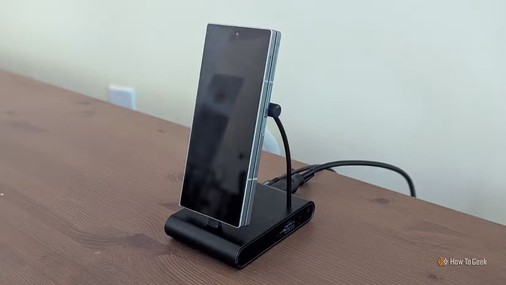 A Samsung Galaxy Z Fold 6 on a phone dock.