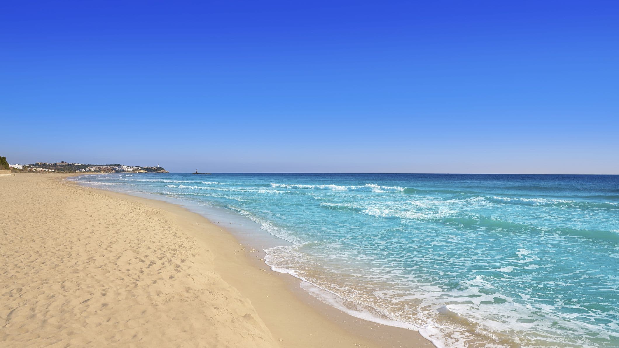 golden sandy beach and sapphire blue water