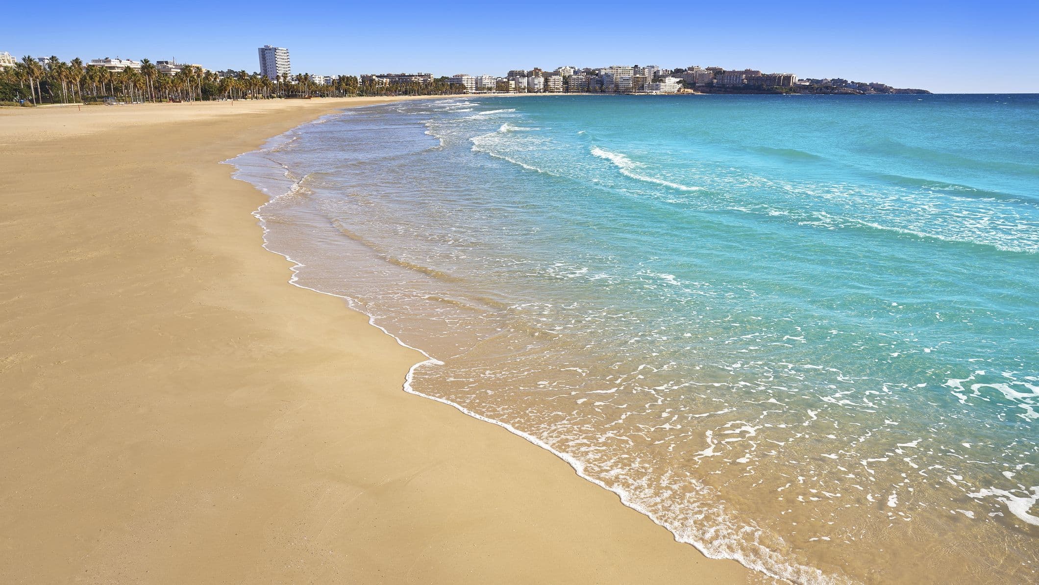 golden yellow sand beach and azure blue water