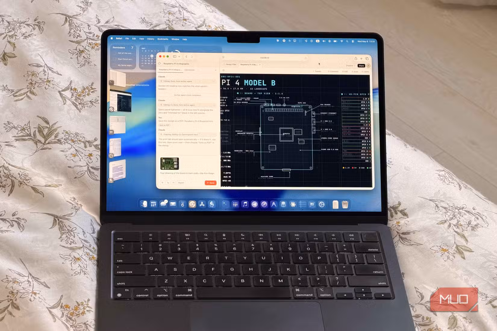A MacBook laptop showing Claude Design building an infographic