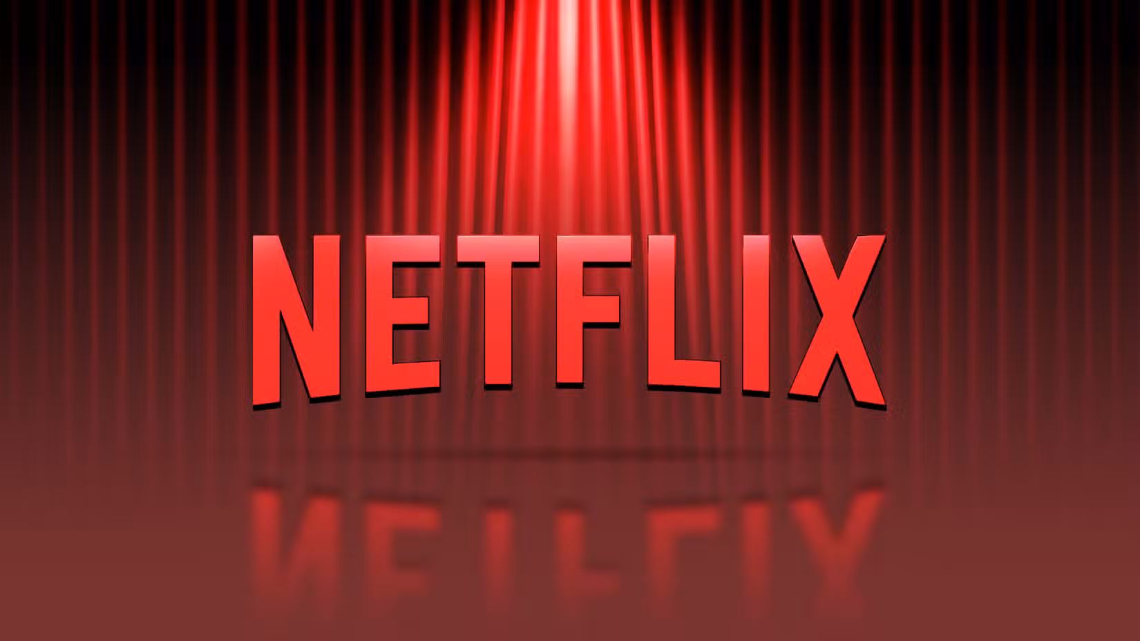 The Netflix logo under a spotlight against a dark red curtain background with a glossy floor reflection.