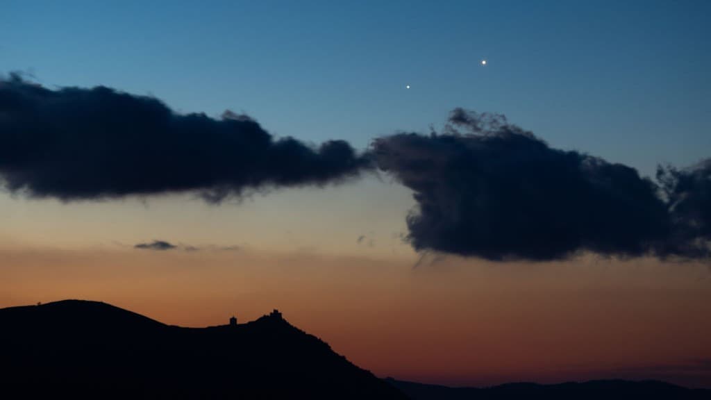 two bright dots in the sky, venus and jupiter conjunction.