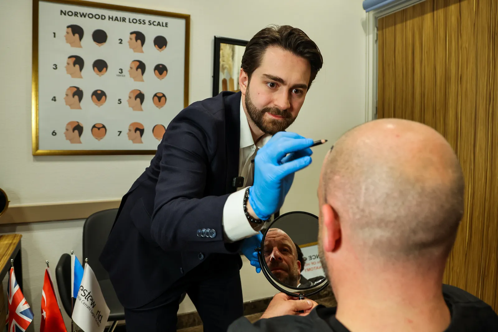 Image may contain Lou DiBella Clothing Glove Adult Person Hairdresser Face Head and Haircut