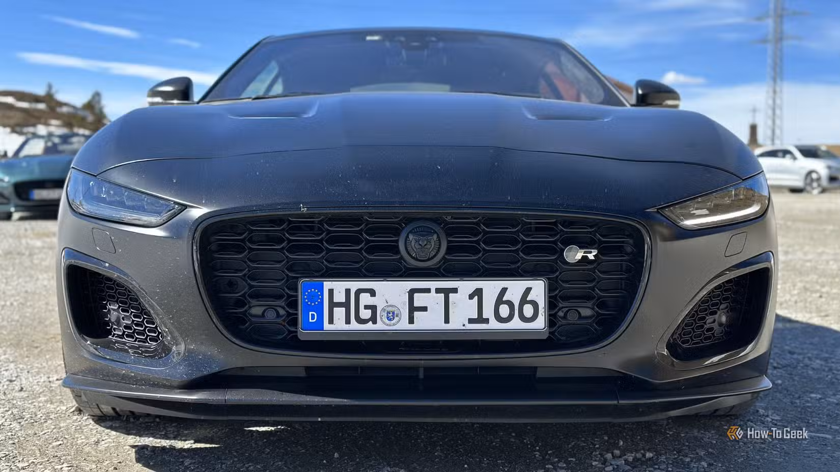 Static front-end shot of a black 2023 Jaguar F-Type R 75.