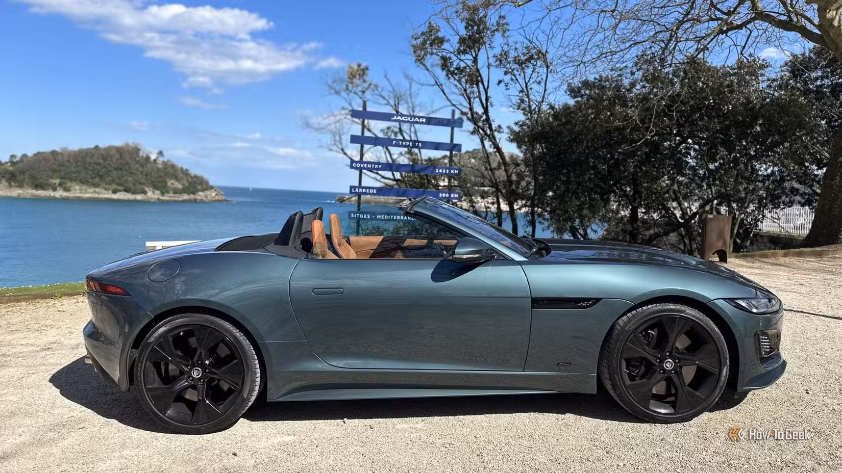 Static saide profile shot of a green 2025 Jaguar F-Type 75 Convertible.