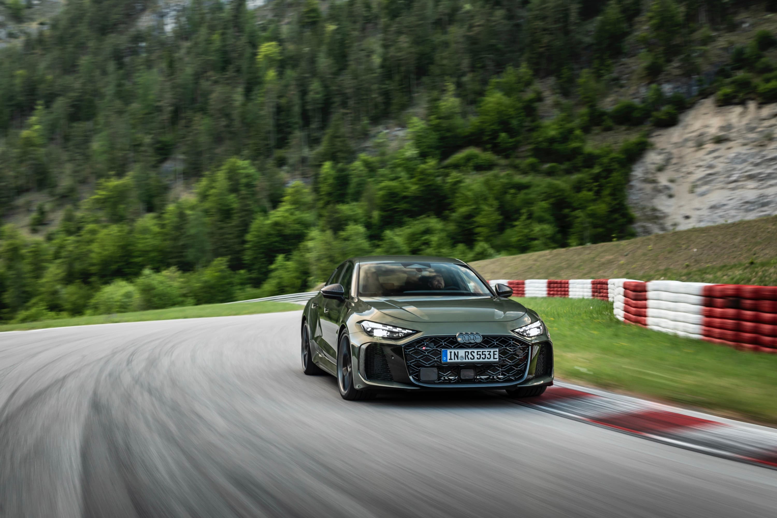 A green Audi RS5 on track