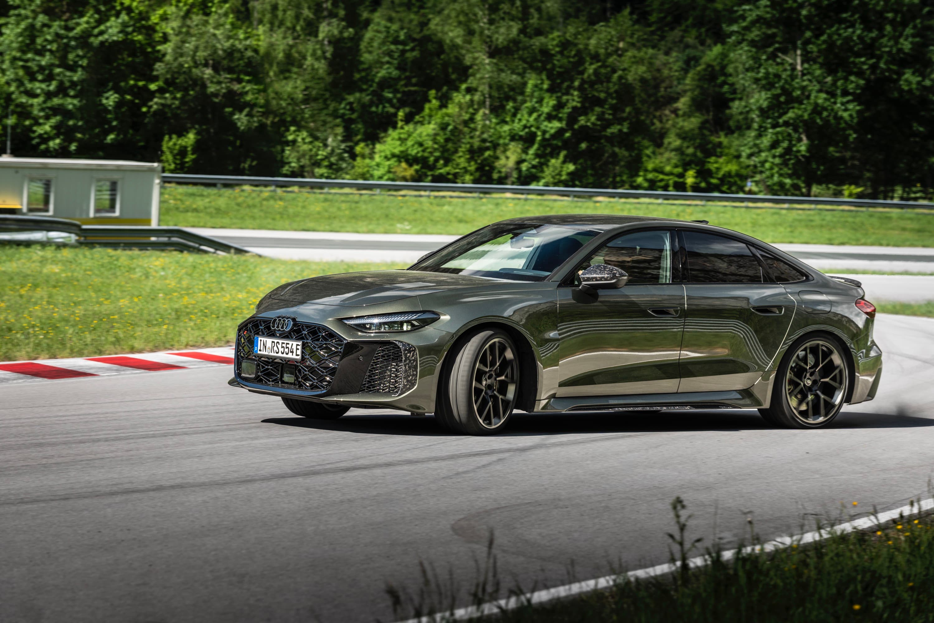 A green Audi RS5 on track