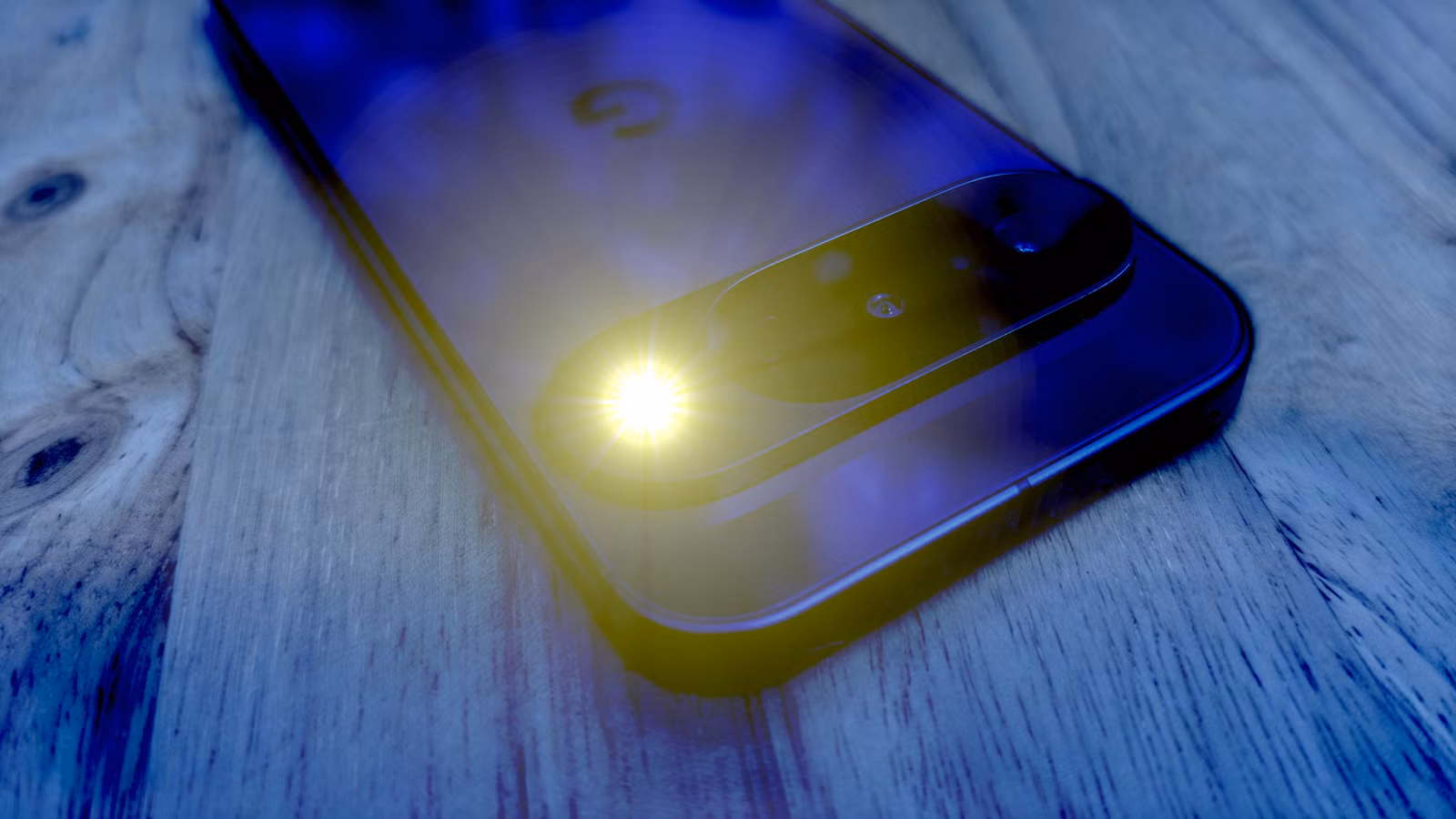 Google Pixel phone with flashlight on