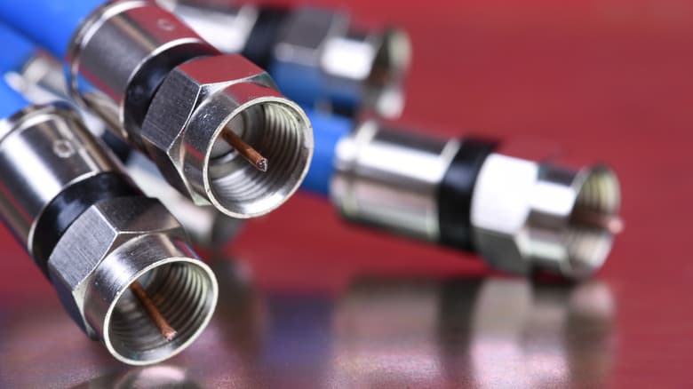Photo of four blue coax cables with silver metal connectors at the ends.