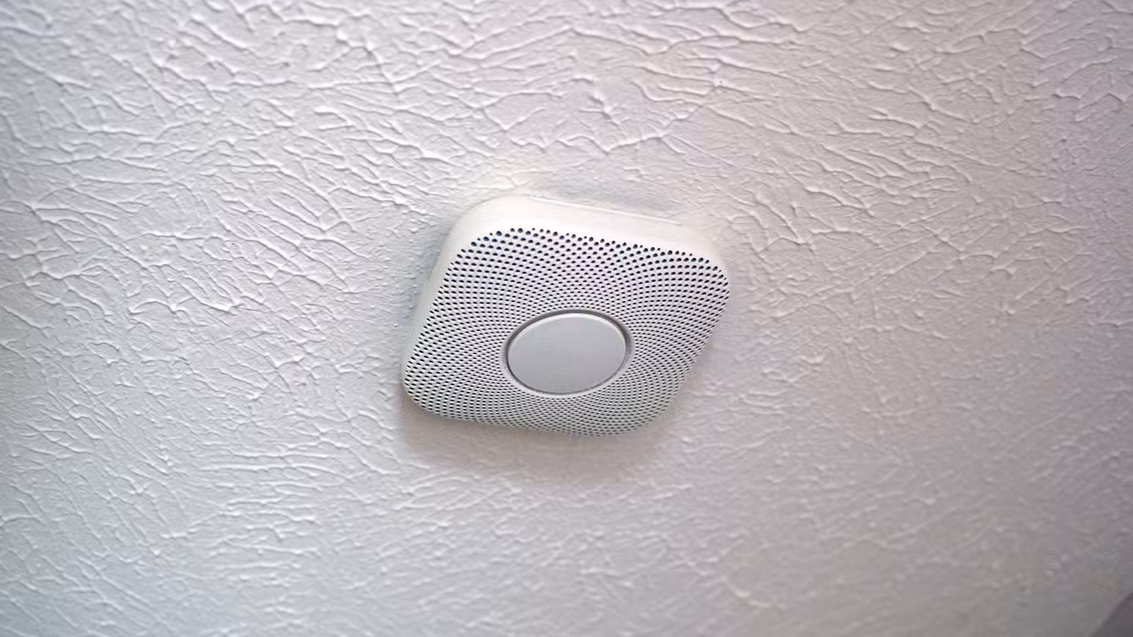 The Nest Protect 2nd Gen Smart Smoke Detector on a ceiling.