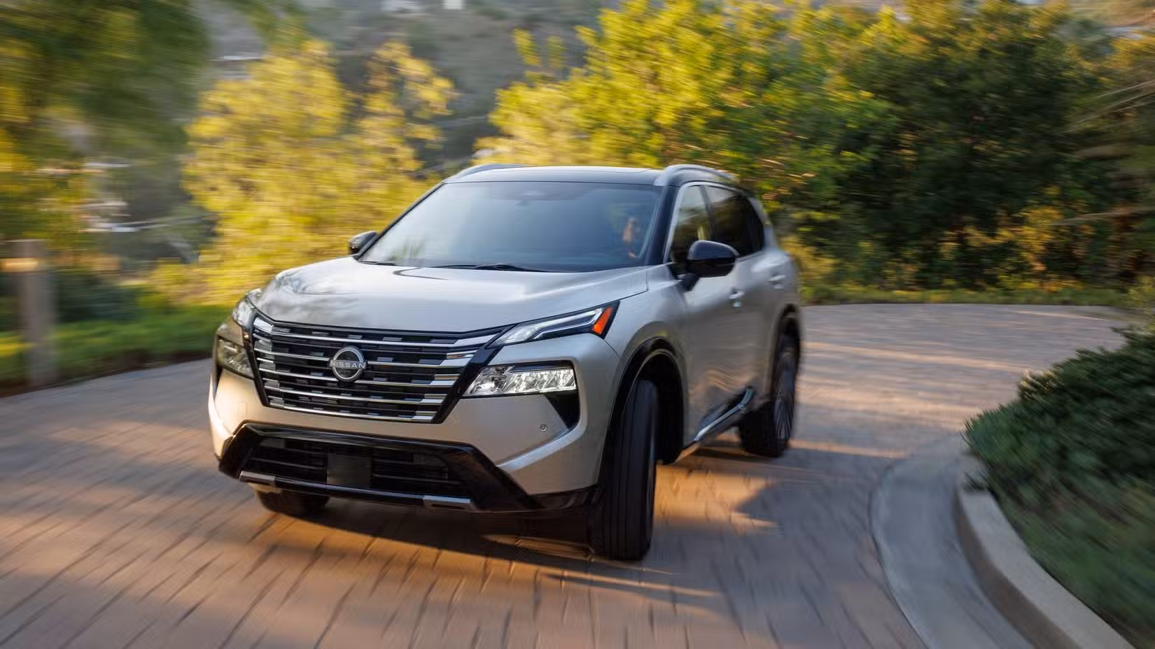 Front 3/4 action shot of a 2024 Nissan Rogue