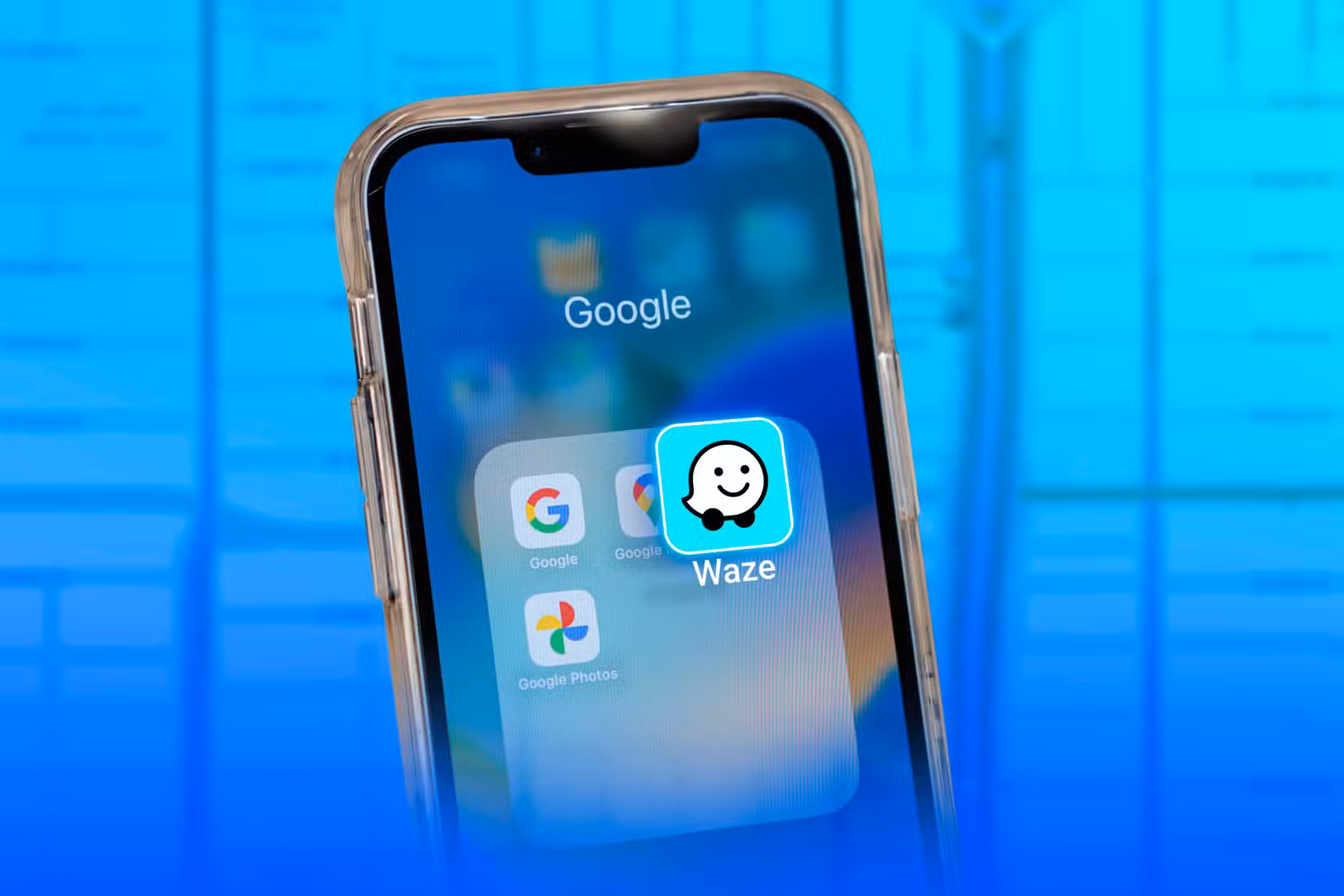 A phone with the Waze icon overlapping the Google Maps icon.