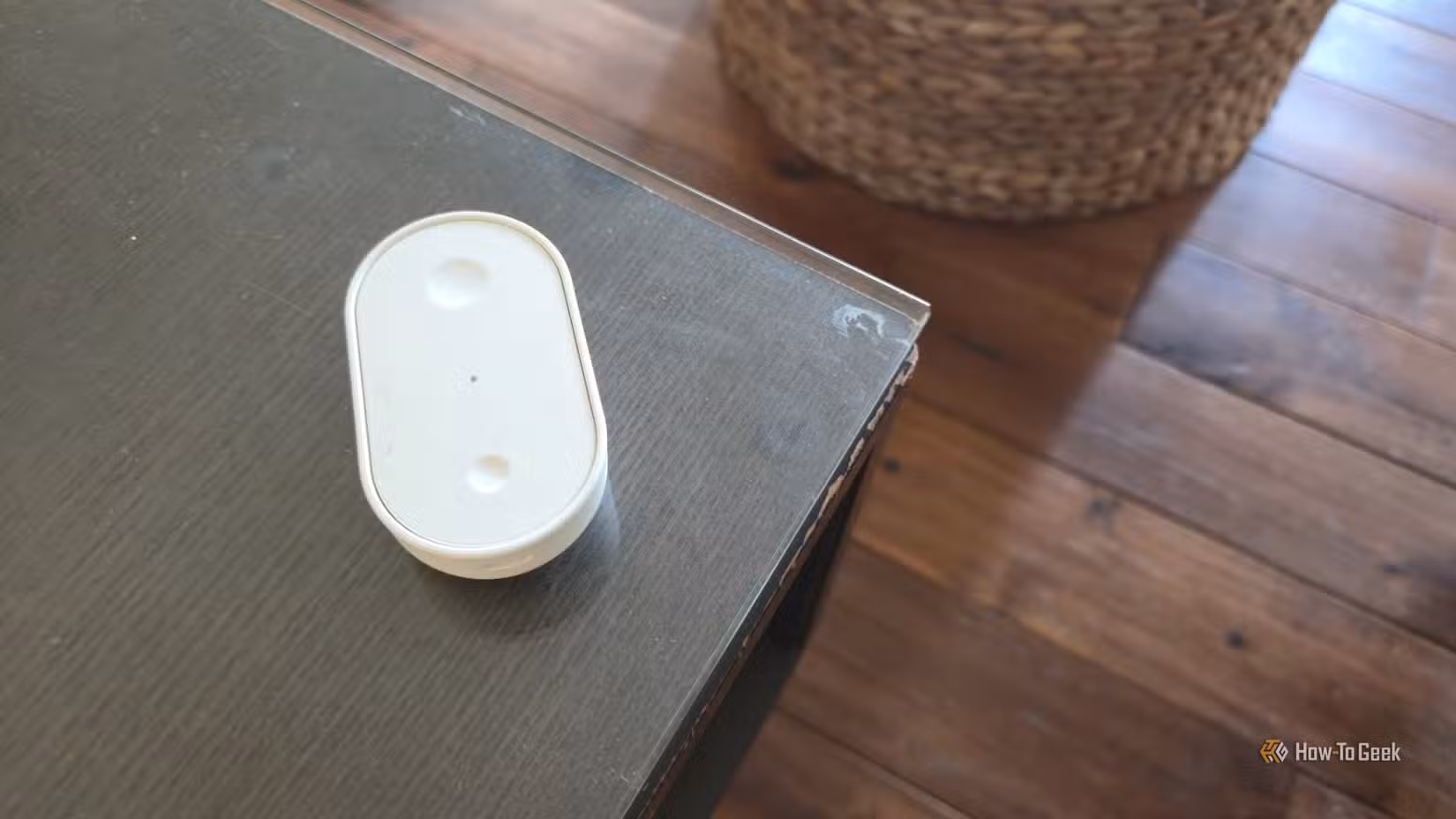 IKEA BILRESA smart remote on a coffee table.
