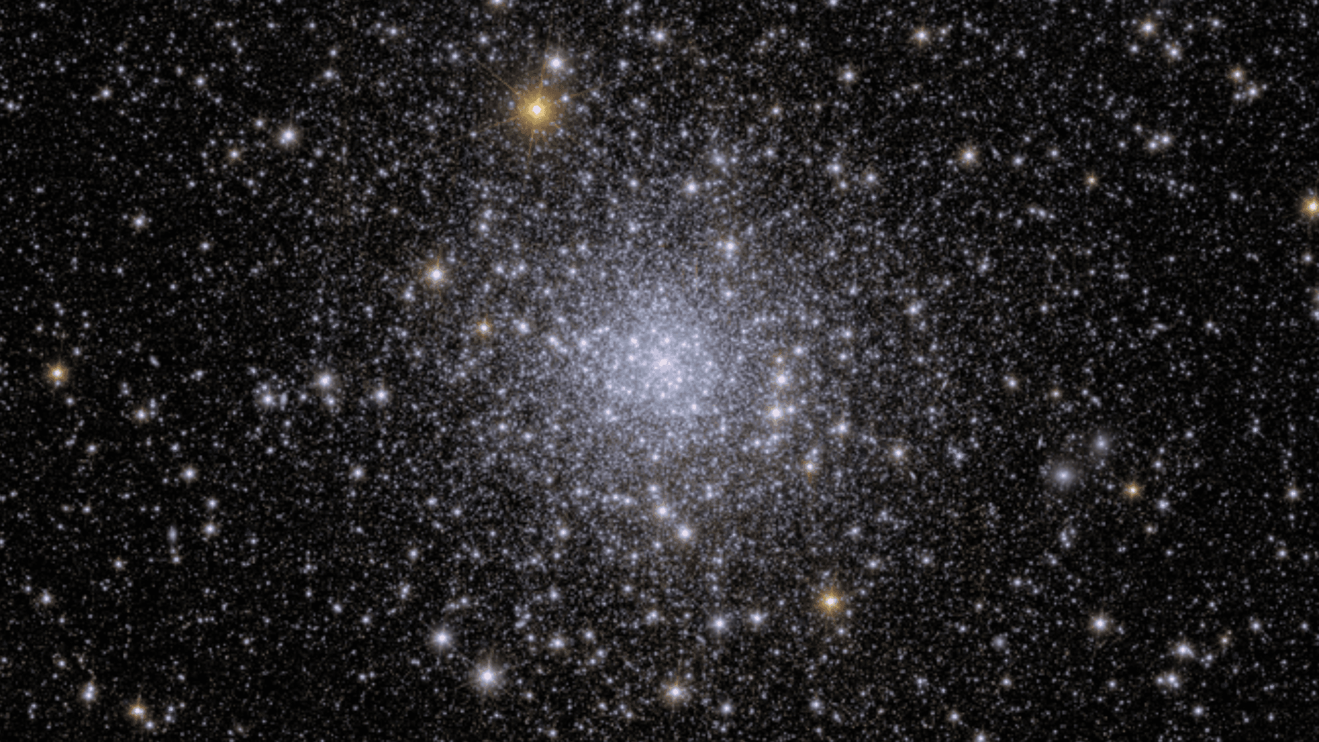 A glittering bundle of stars against the darkness of space.