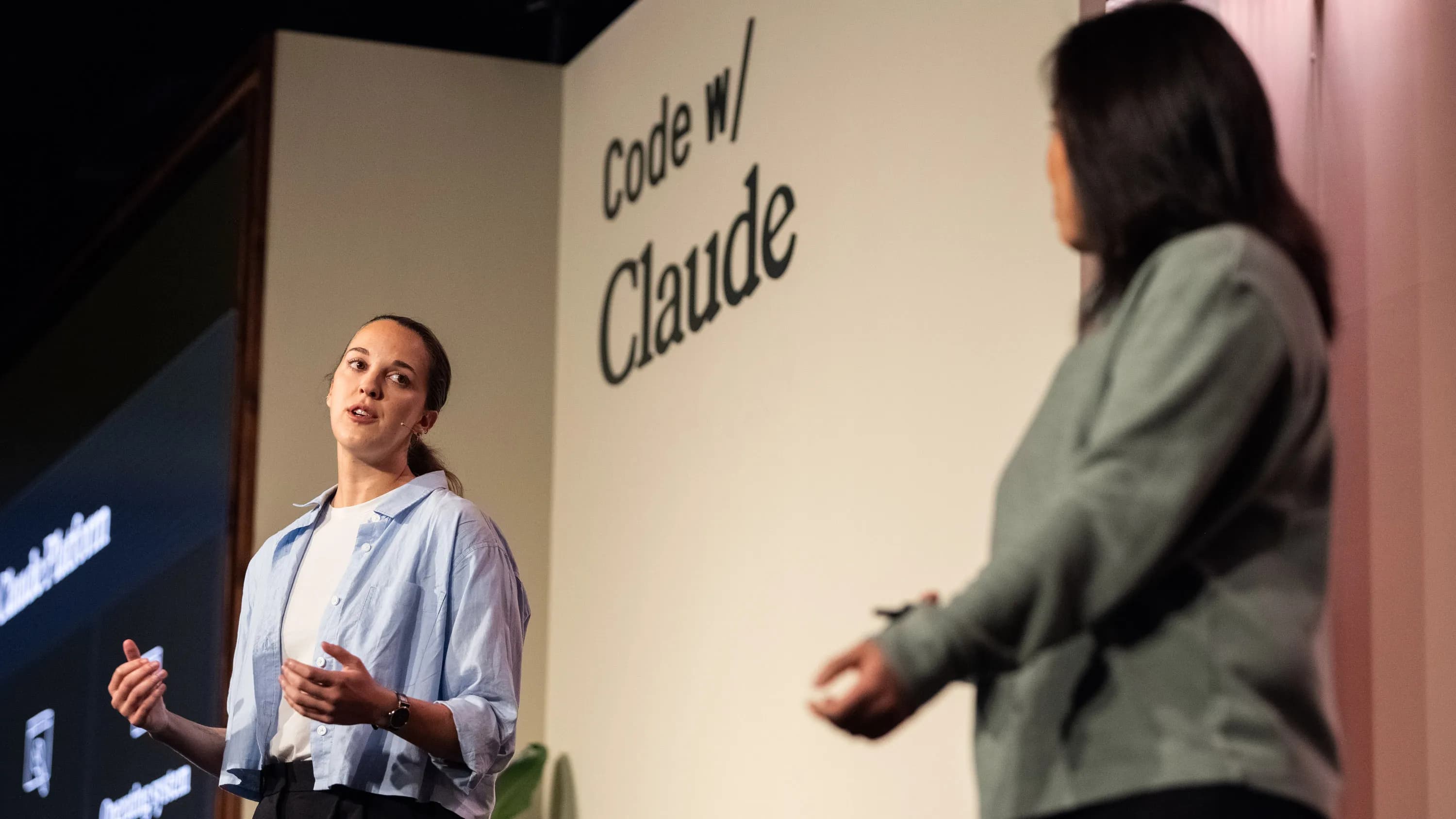 two speakers on stage at the Code with Claude event in London
