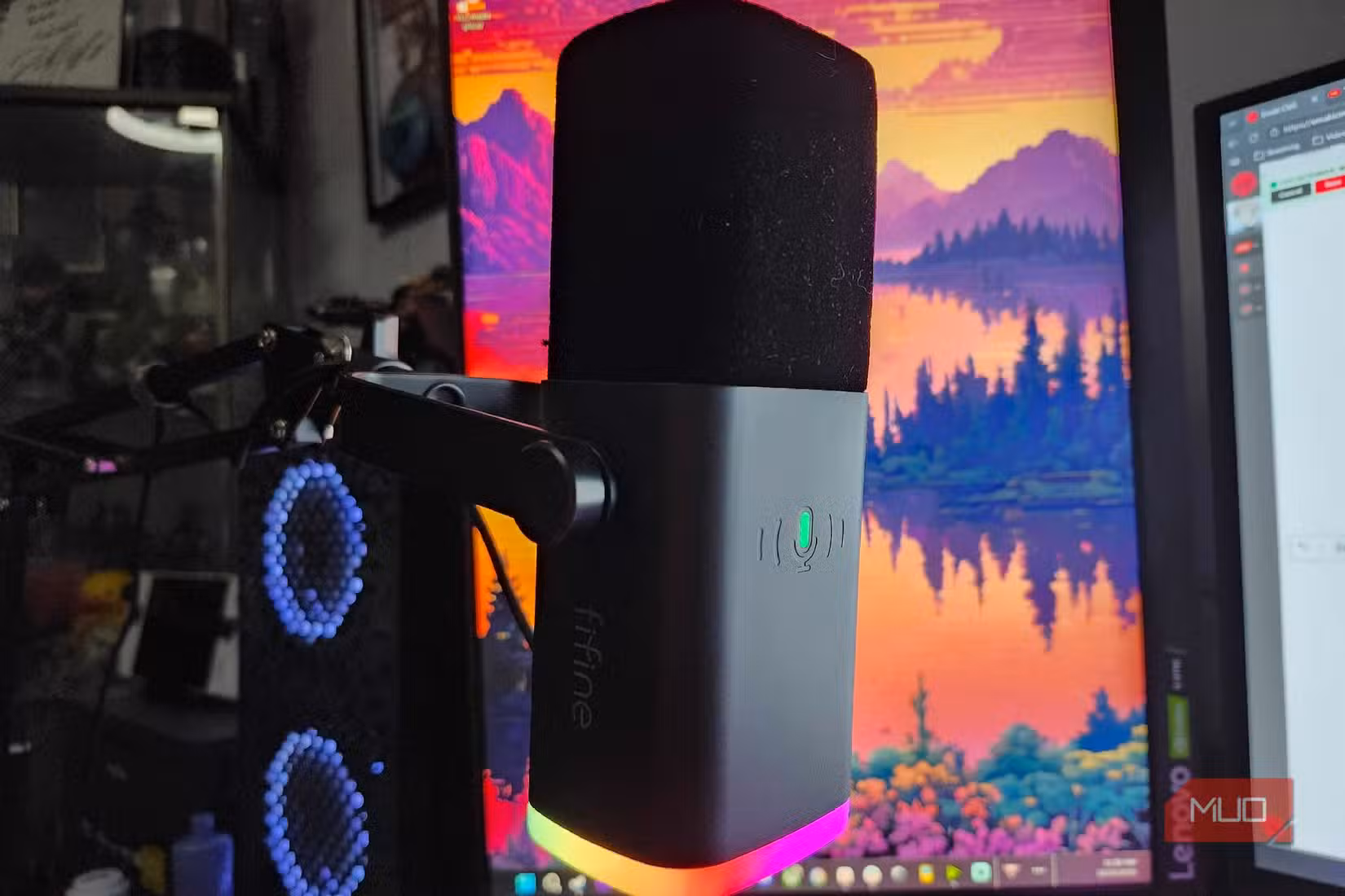 FIFINE Microphone on an arm in front of a monitor