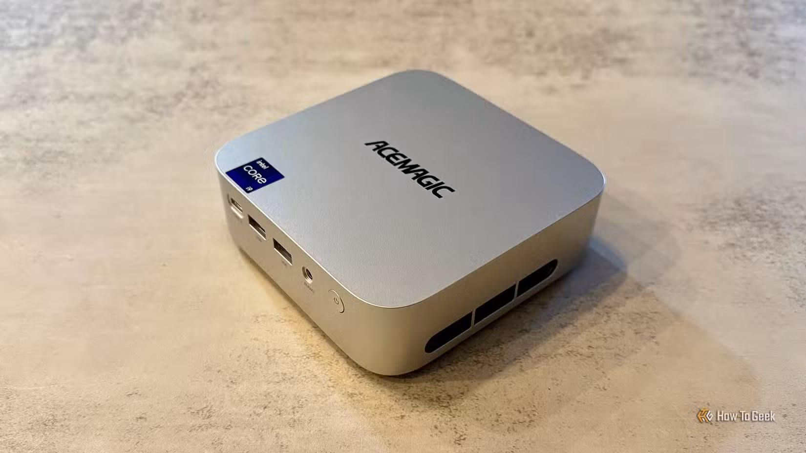 Overhead angled view of the ACEMAGIC M1 Mini PC on a table top.