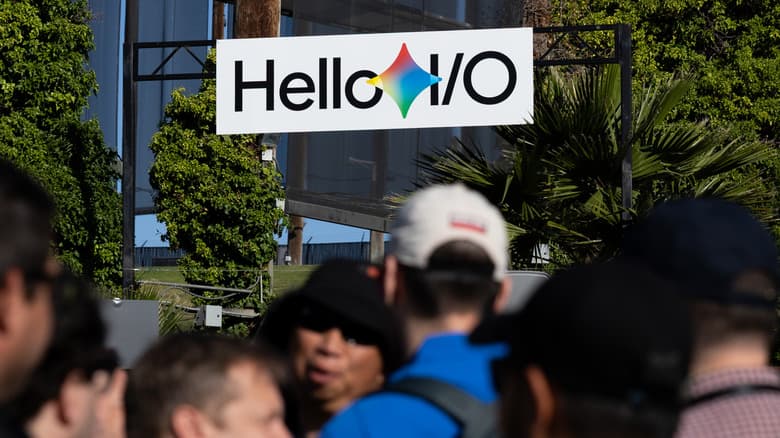 People milling below a sign that reads