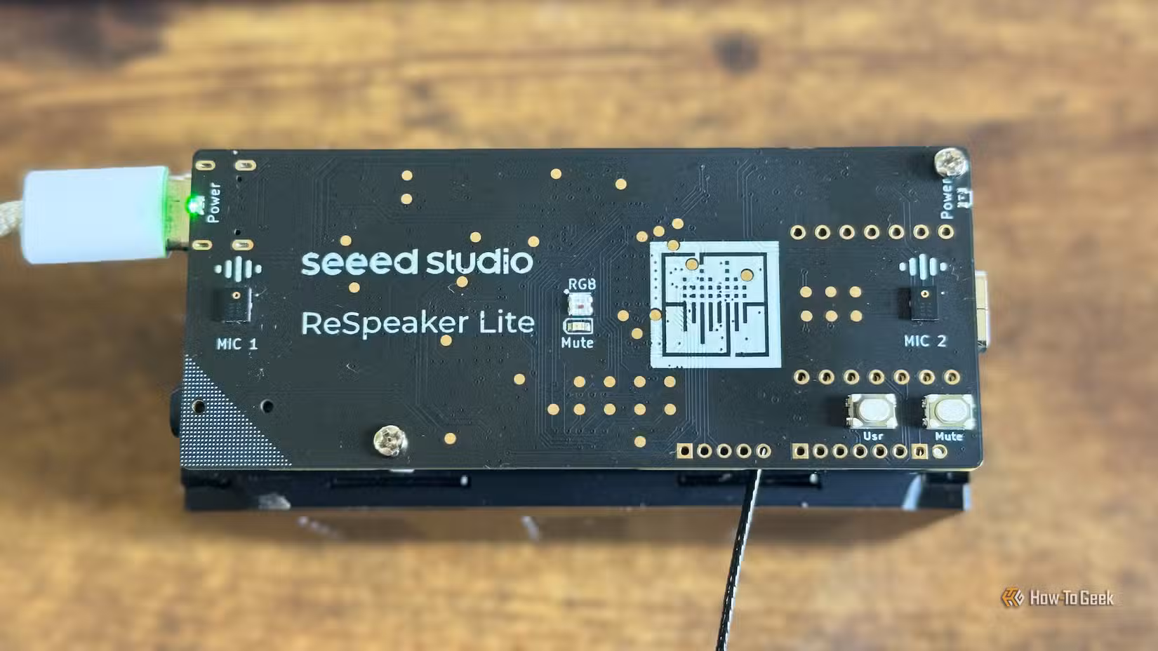 The Seeed Studio reSpeaker Lite ESP32 development board on top of a speaker.