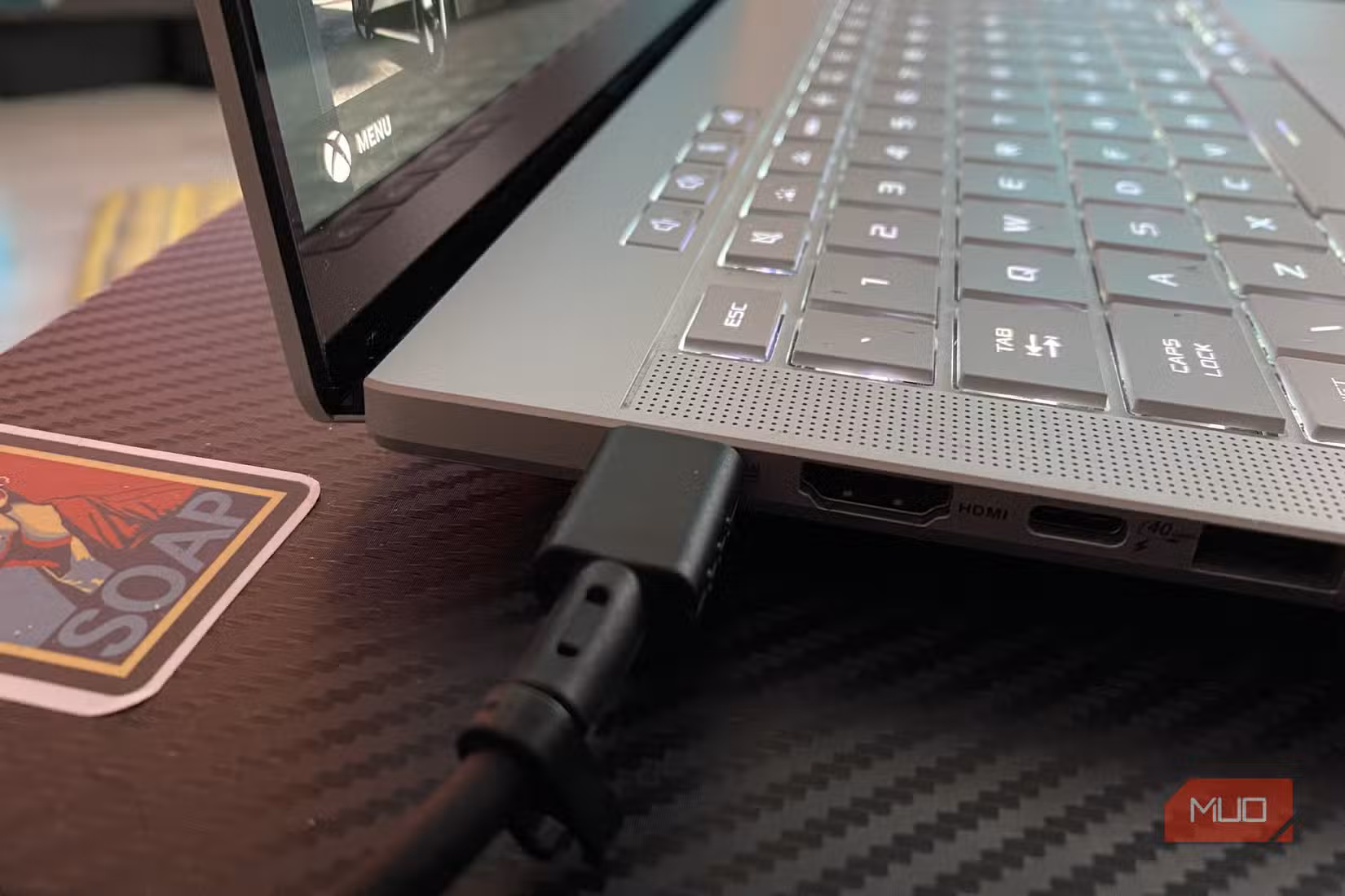 USB-C power cable connected to a gaming laptop