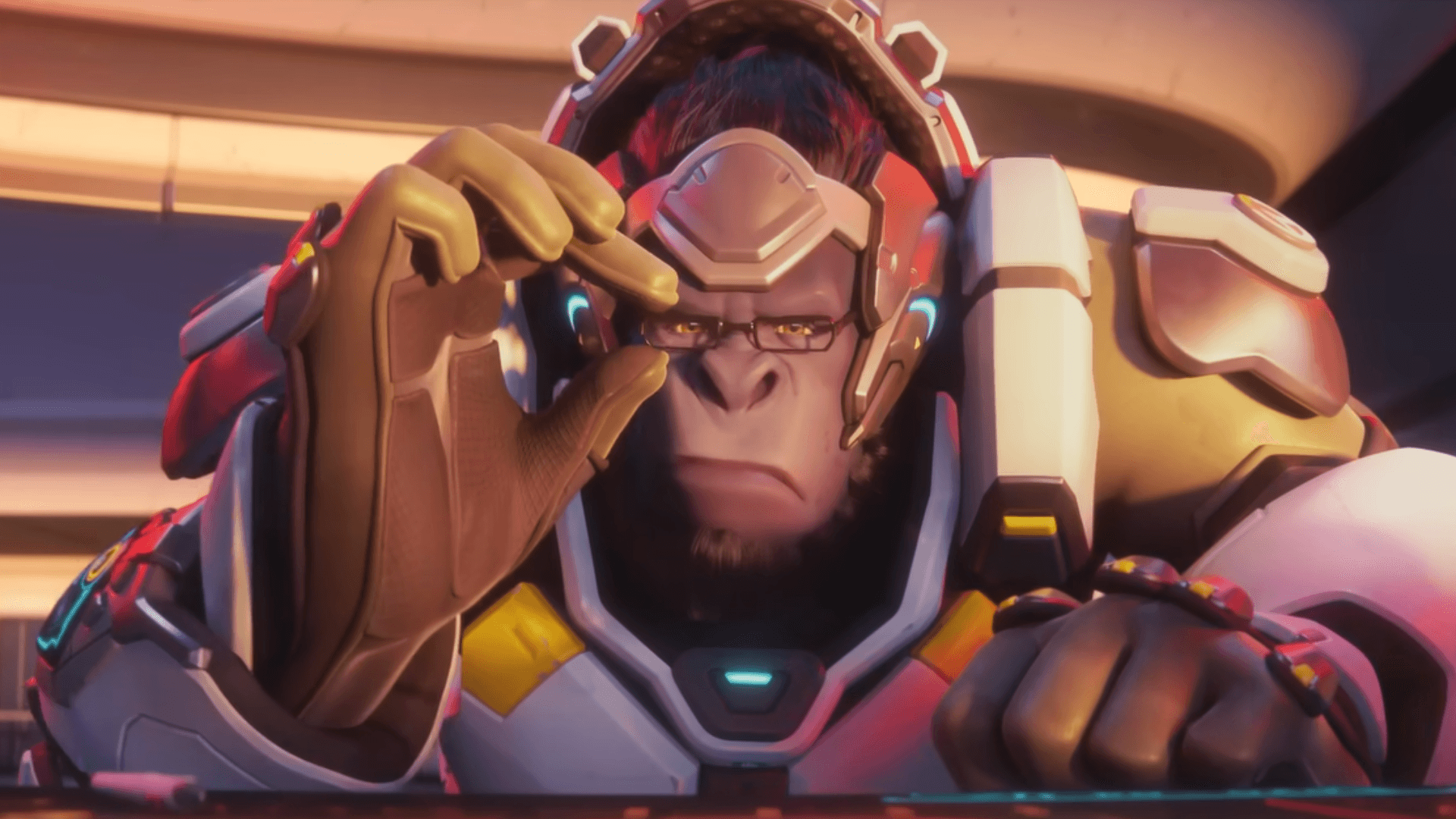 Winston adjusting his glasses while looking at a screen