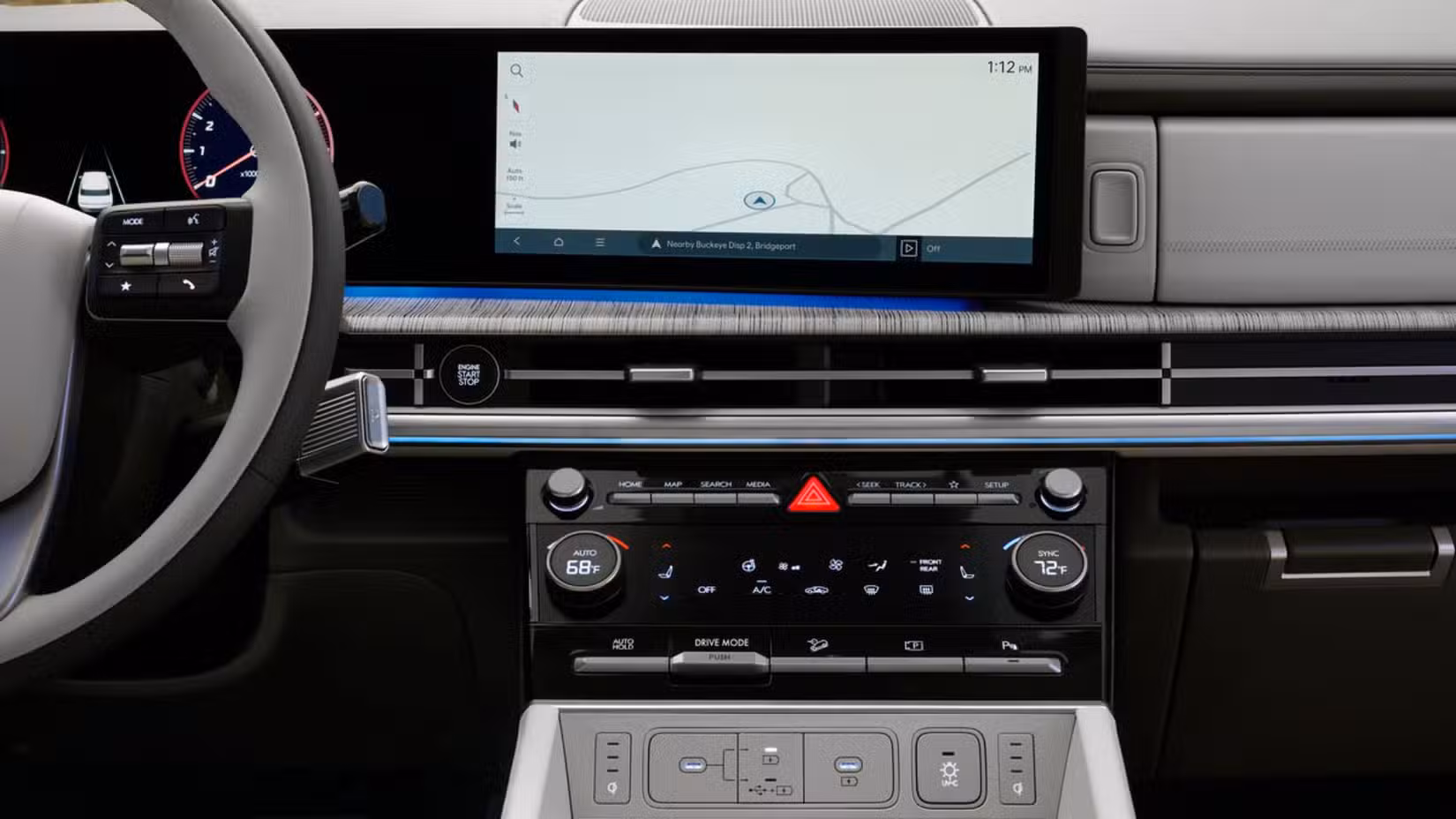 Close-up shot of the dashboard in a 2025 Hyundai Santa Fe Hybrid, showing the infotainment screen and driver controls.
