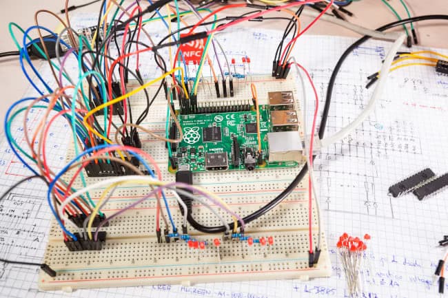 Raspberry Pi single-board computer connected to a breadboard in a table-top experiment.