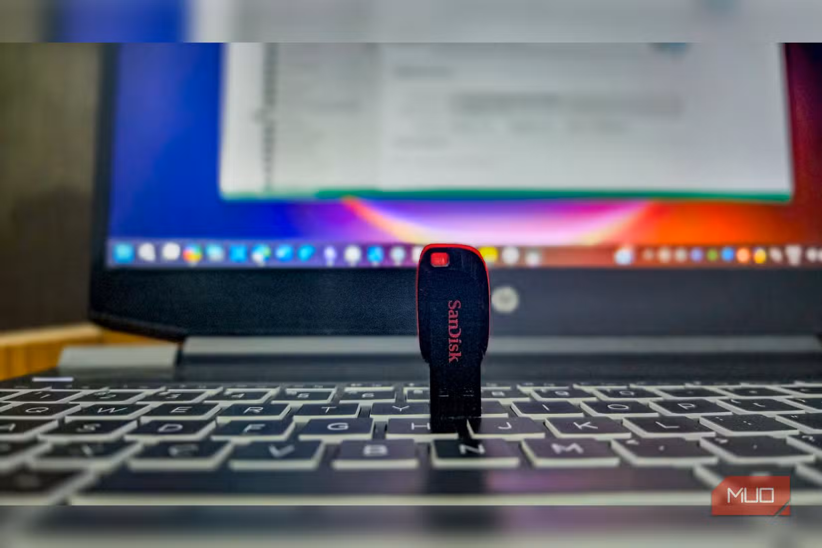 Sandisk USB drive kep on a HP Pavlillion gaming laptop keyboard