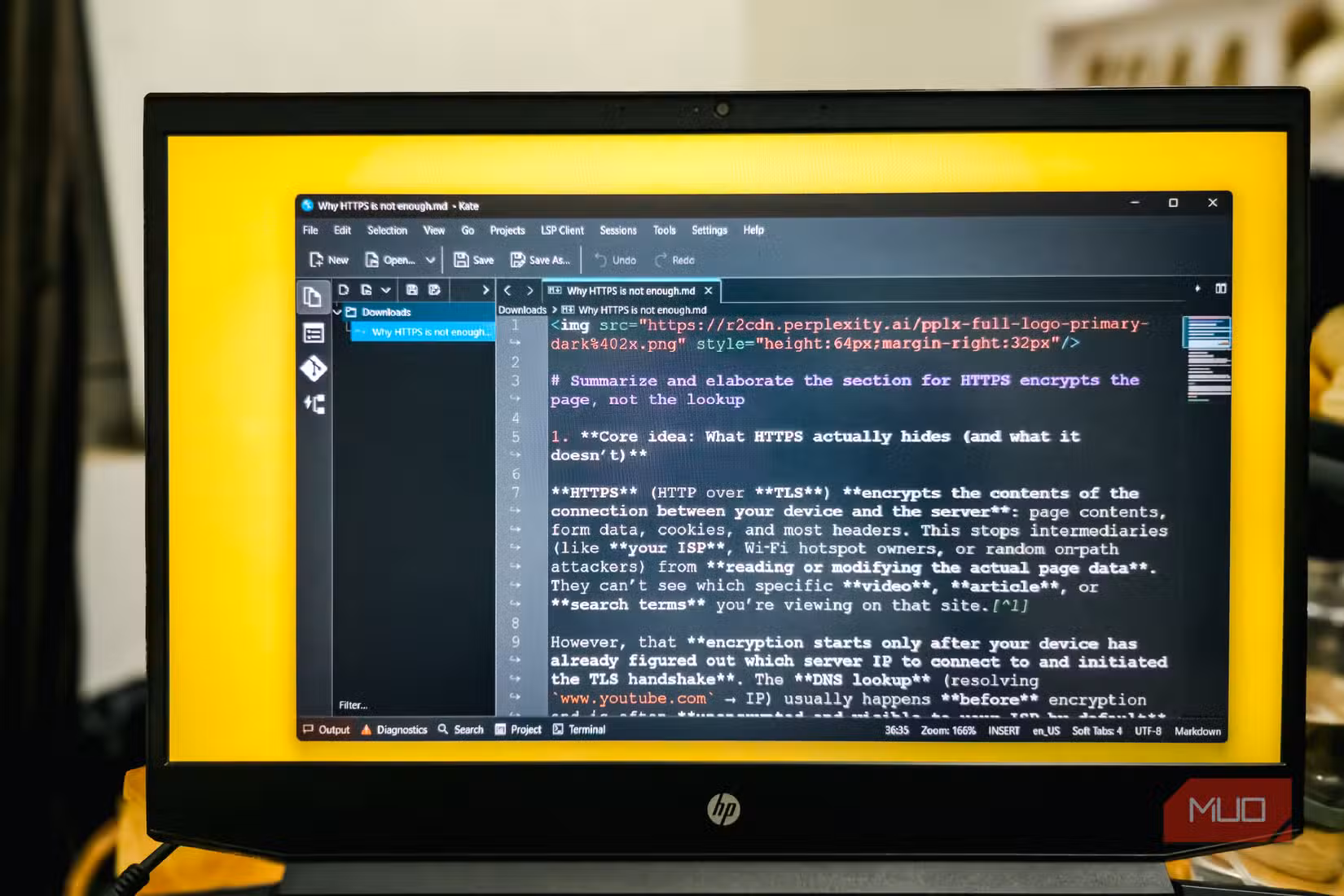 Kate editor open on a HP Pavillion gaming laptop running Windows 11