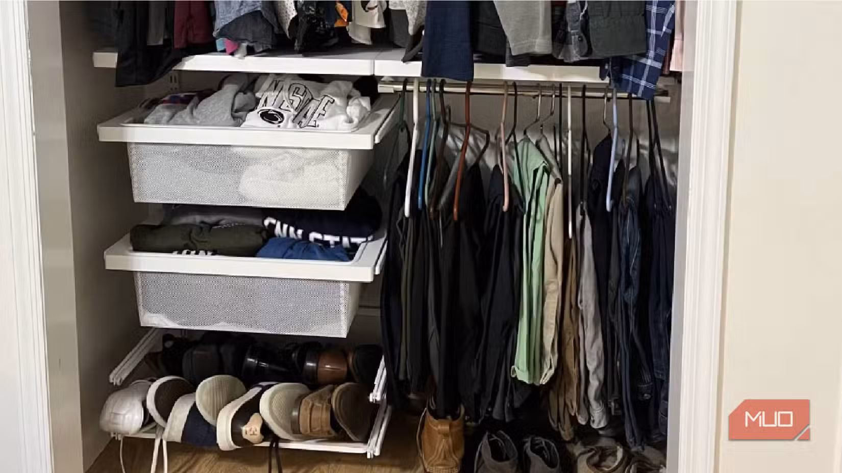 A bedroom closet with a storage system