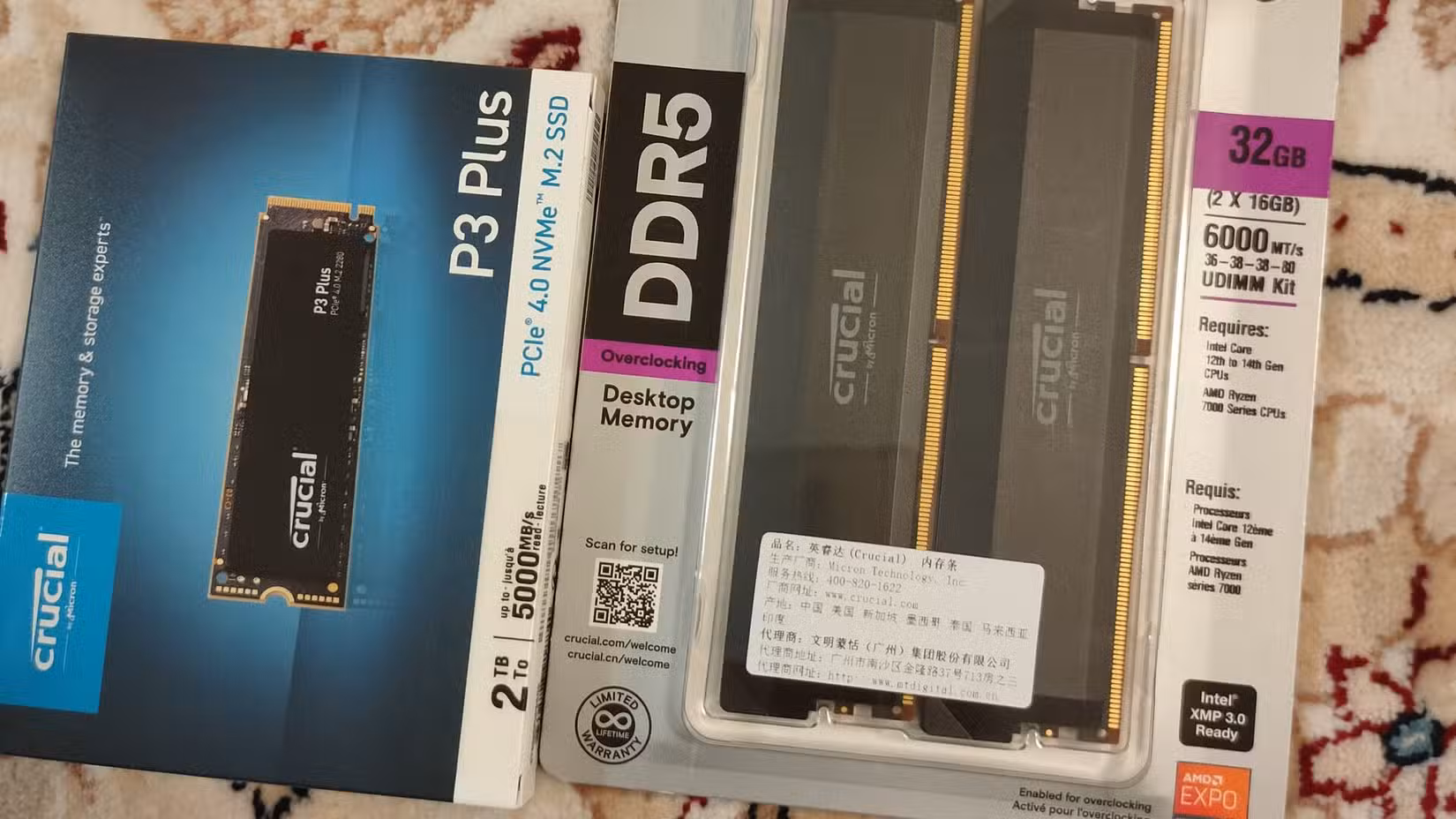 Crucial DDR5 RAM and an M.2 NVMe in their original packaging.