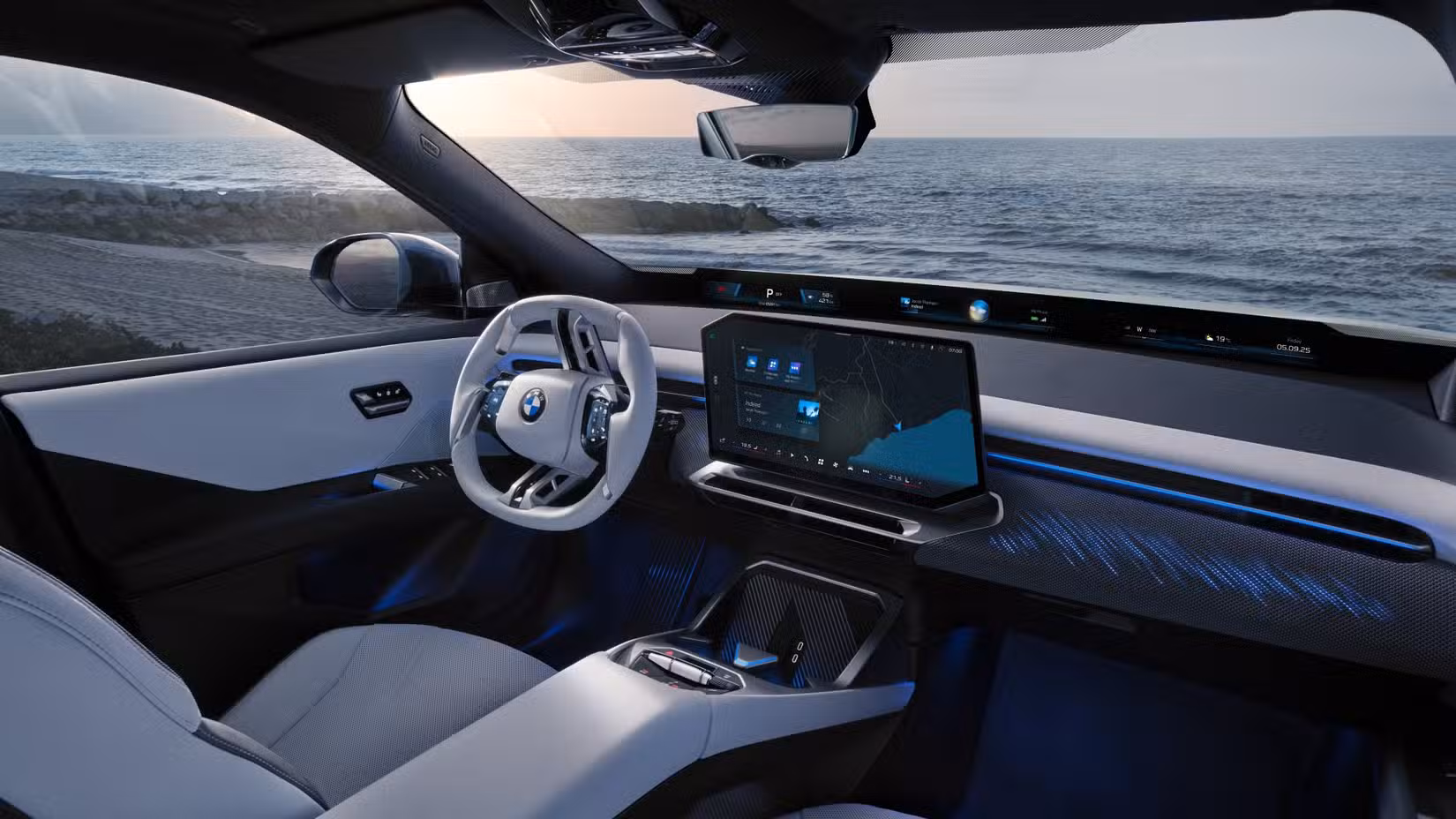 Interior shot of the front seats and dashboard in a 2026 BMW iX3