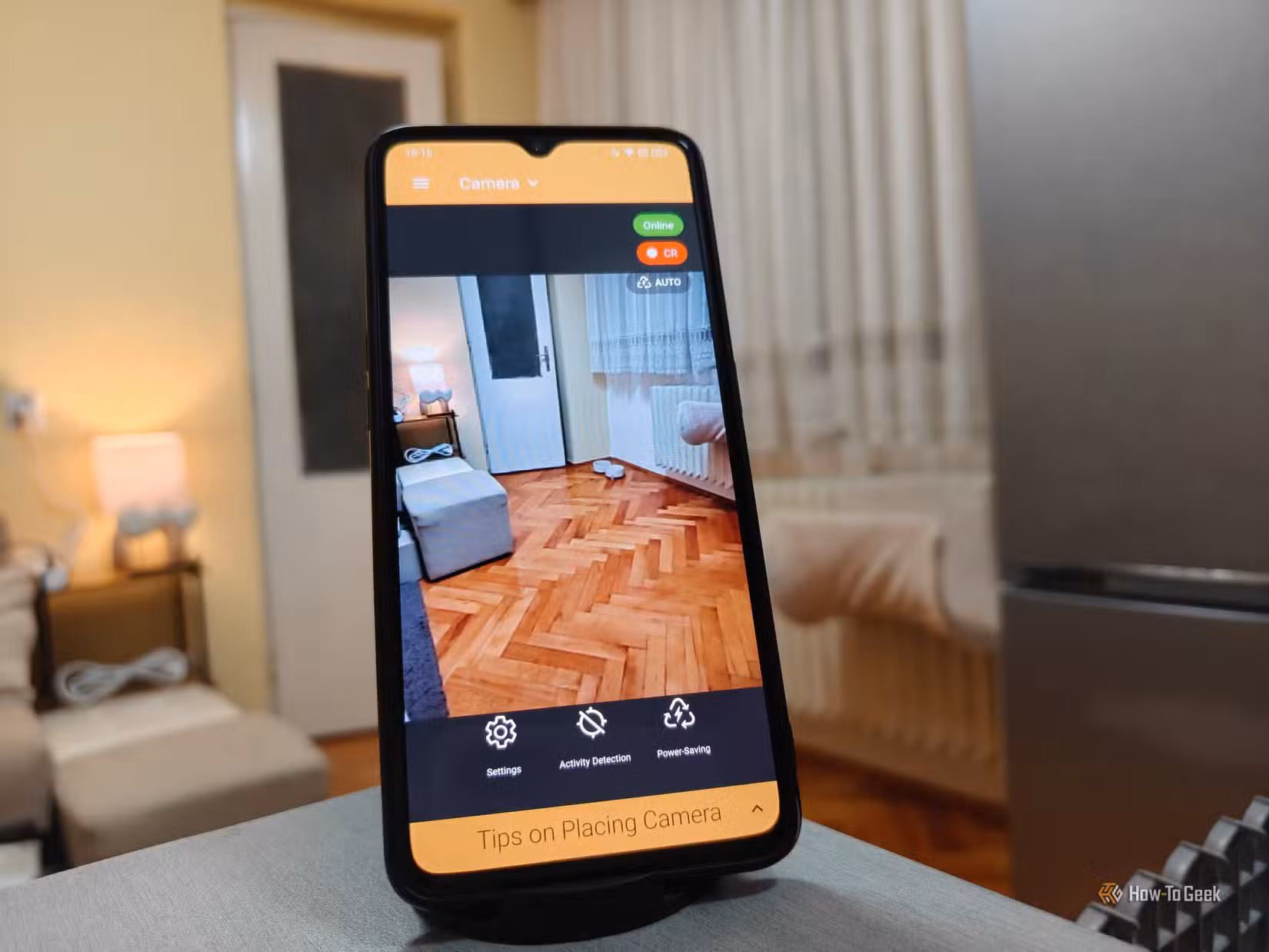 An old phone being used as a security camera.