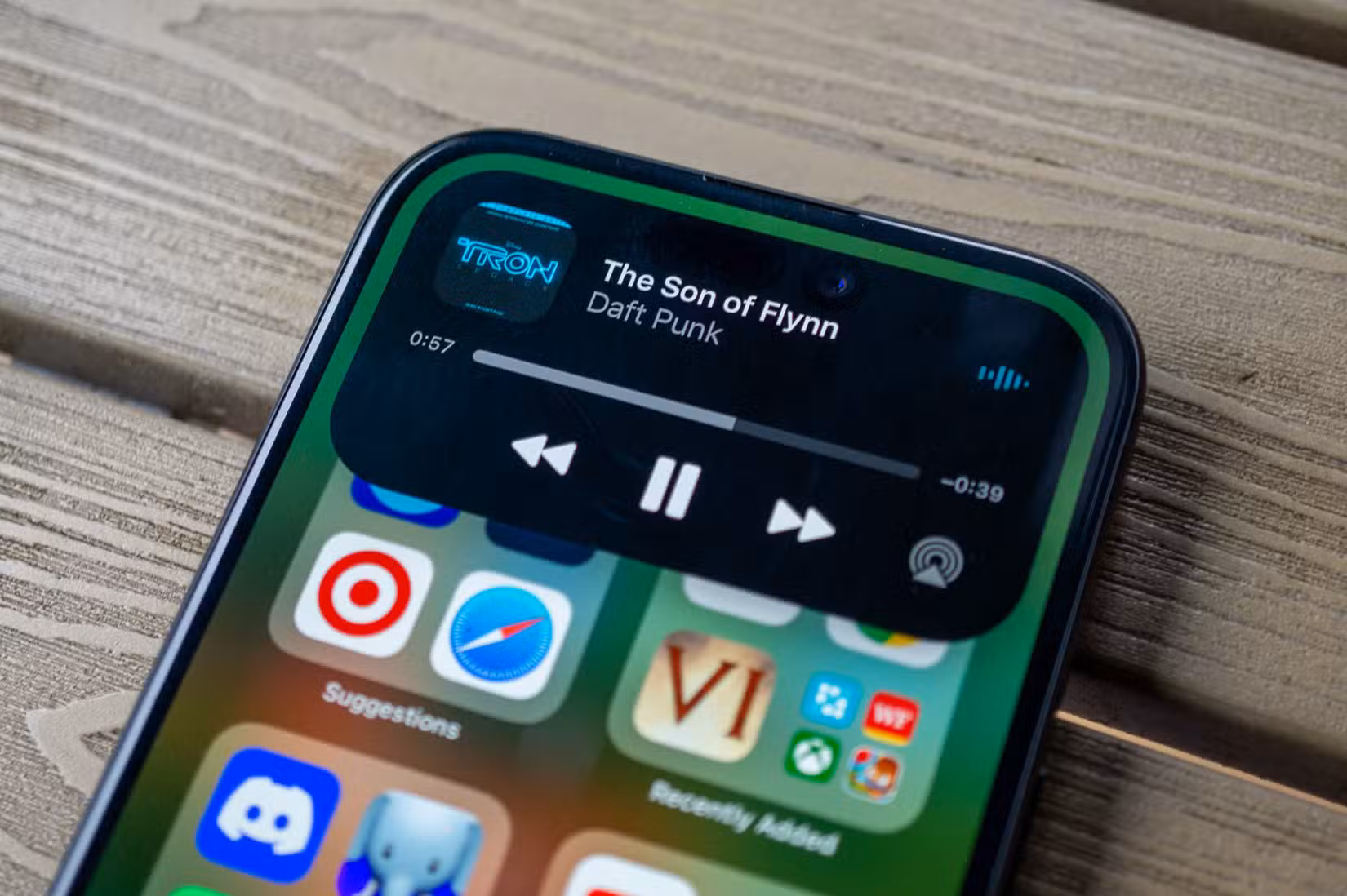 Apple iPhone 15 with Dynamic Island music panel.