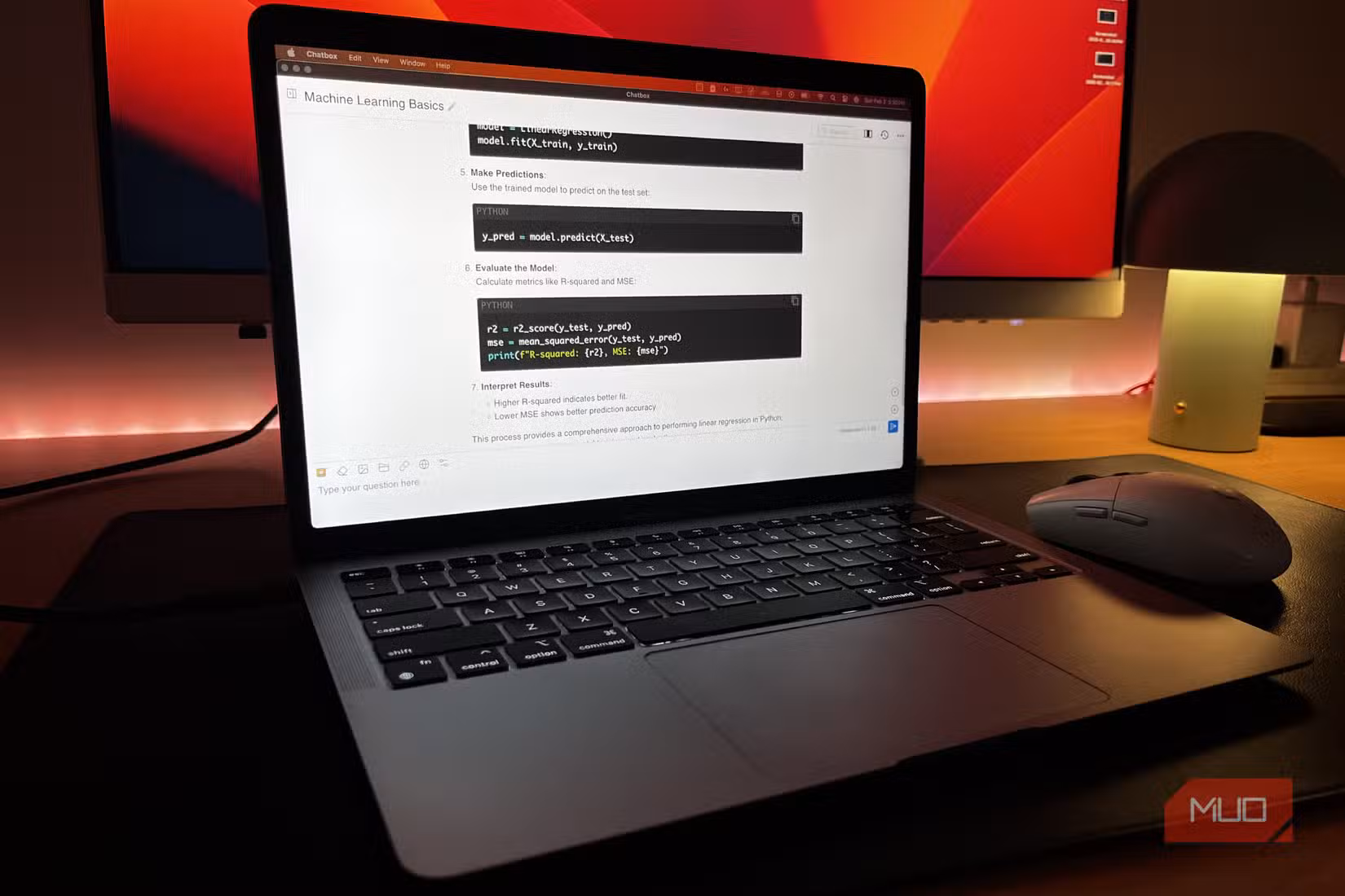 A MacBook Air running DeepSeek-R1 locally with a monitor in the background