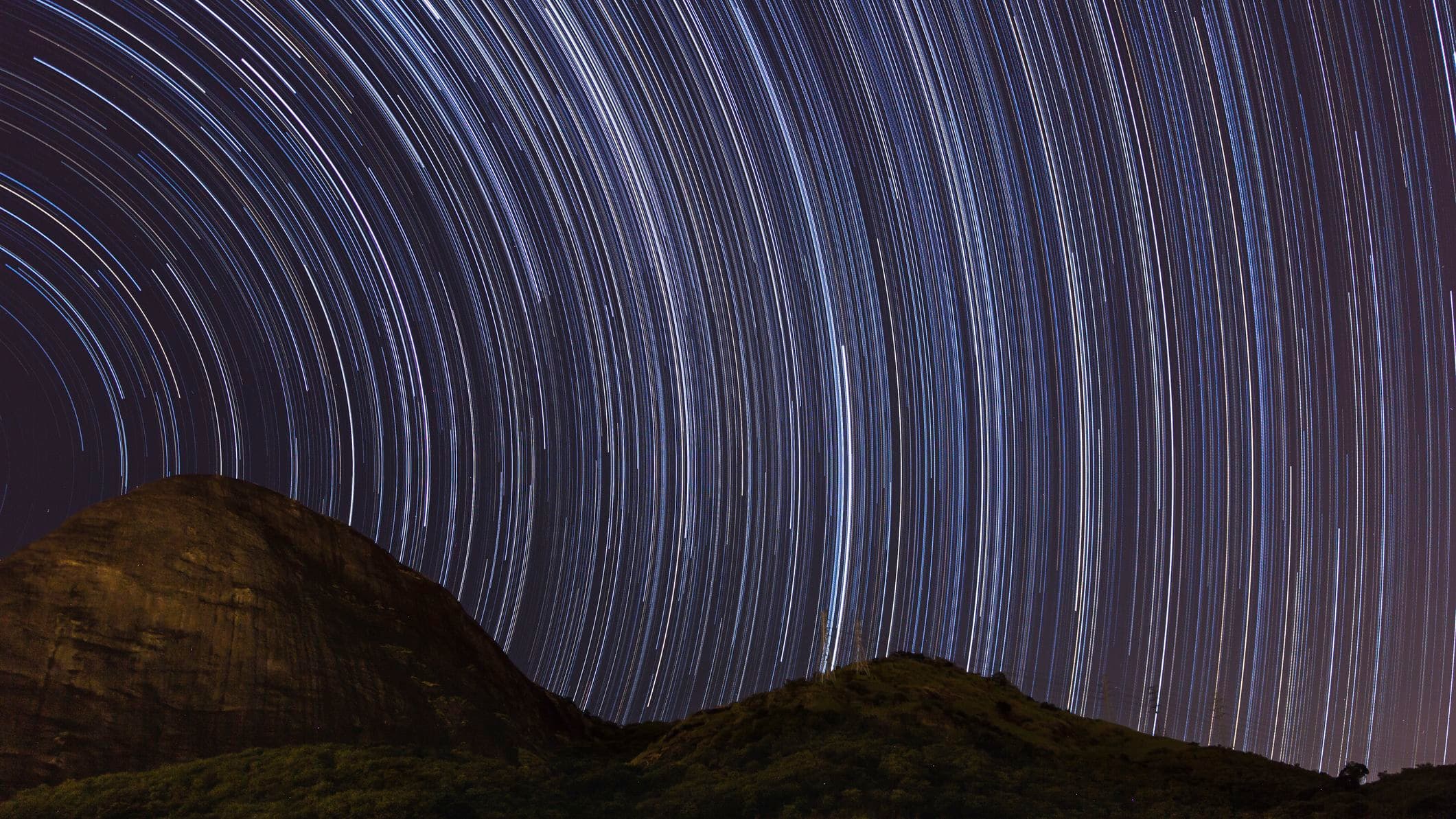 lots of streaks of light stretch through the sky