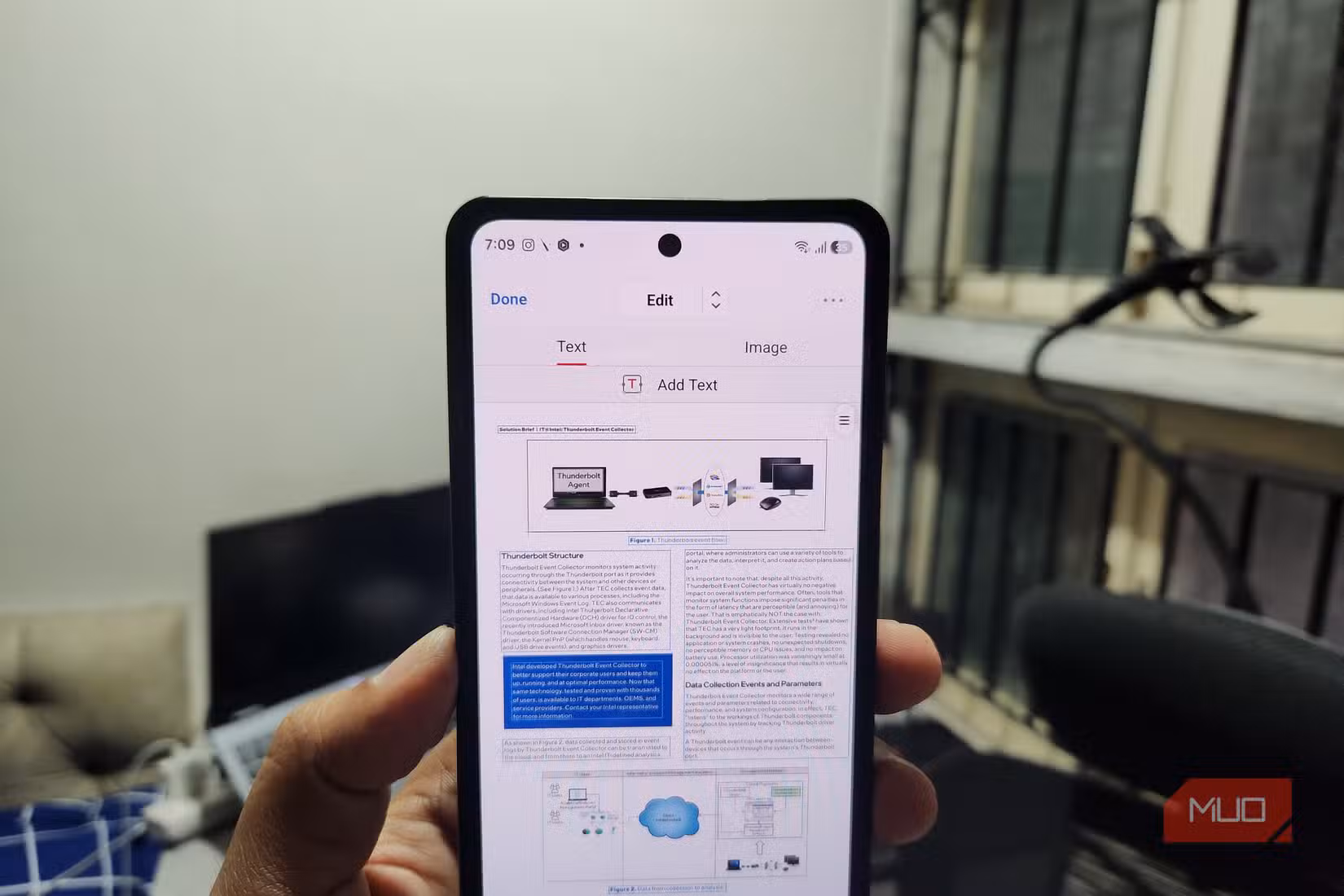 Android phone in hand showing PDF editor