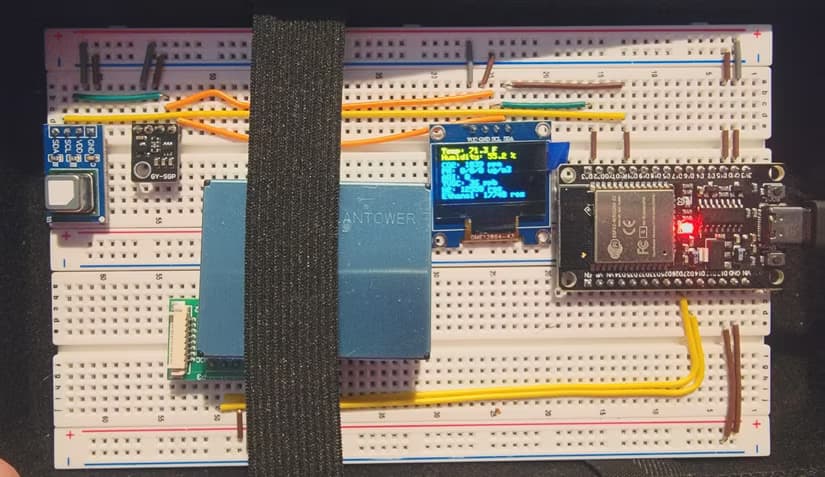 ESP32 project with ESP32 mounted to a breadboard and jumper wires and sensors going all over the place.