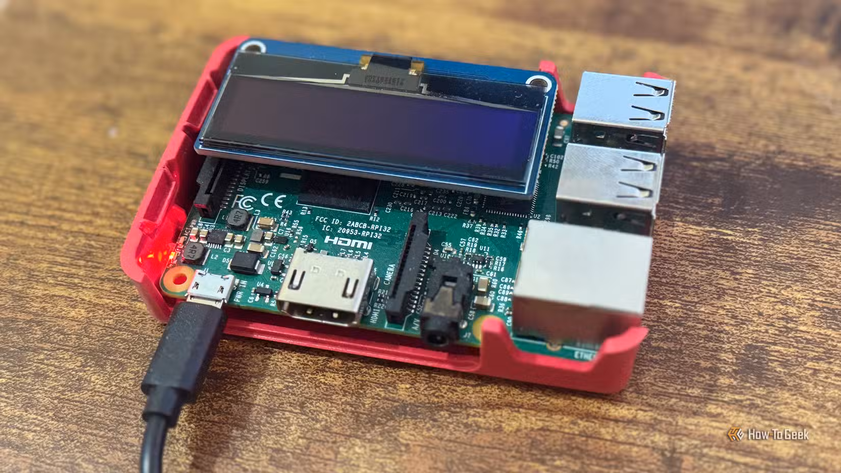 A Raspberry Pi 3B+ with an OLED display attached.